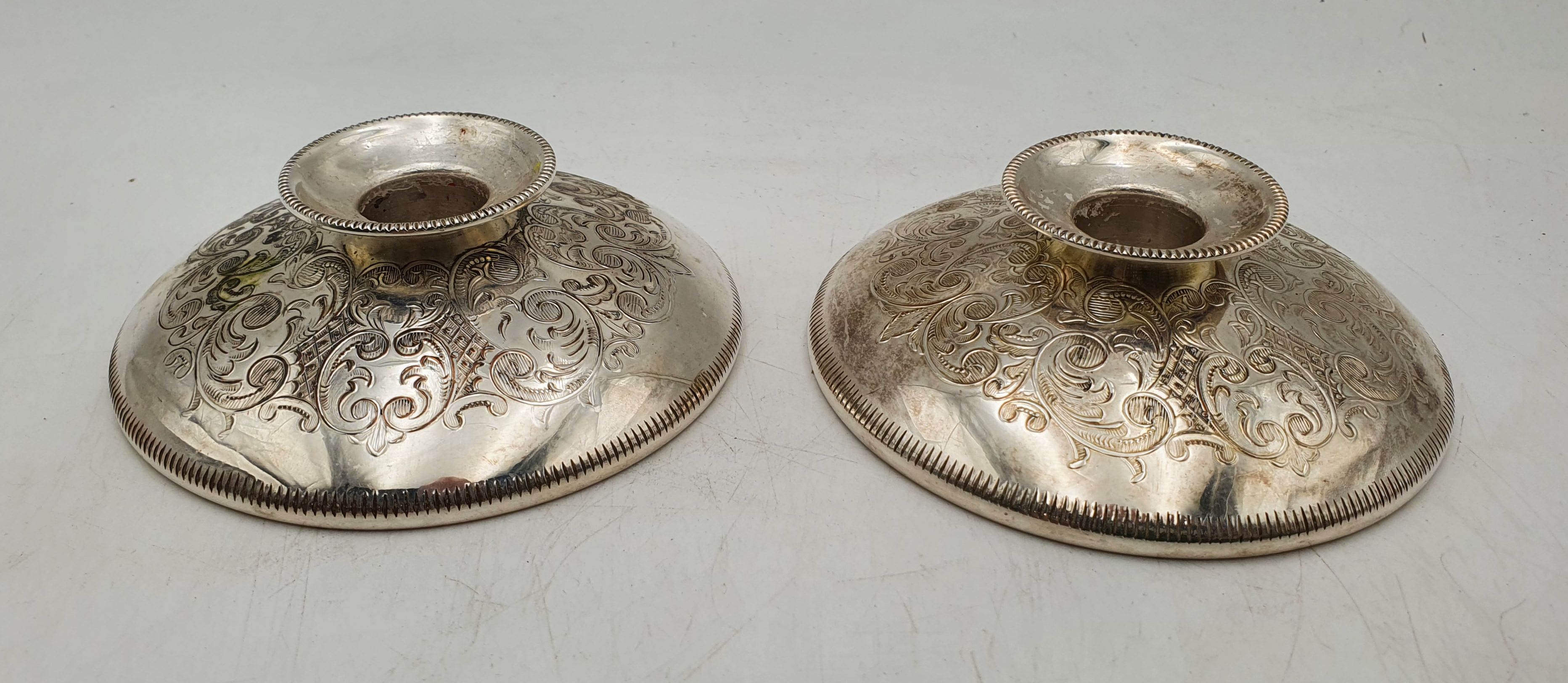 A Pair Of English Silver Plated Candlesticks