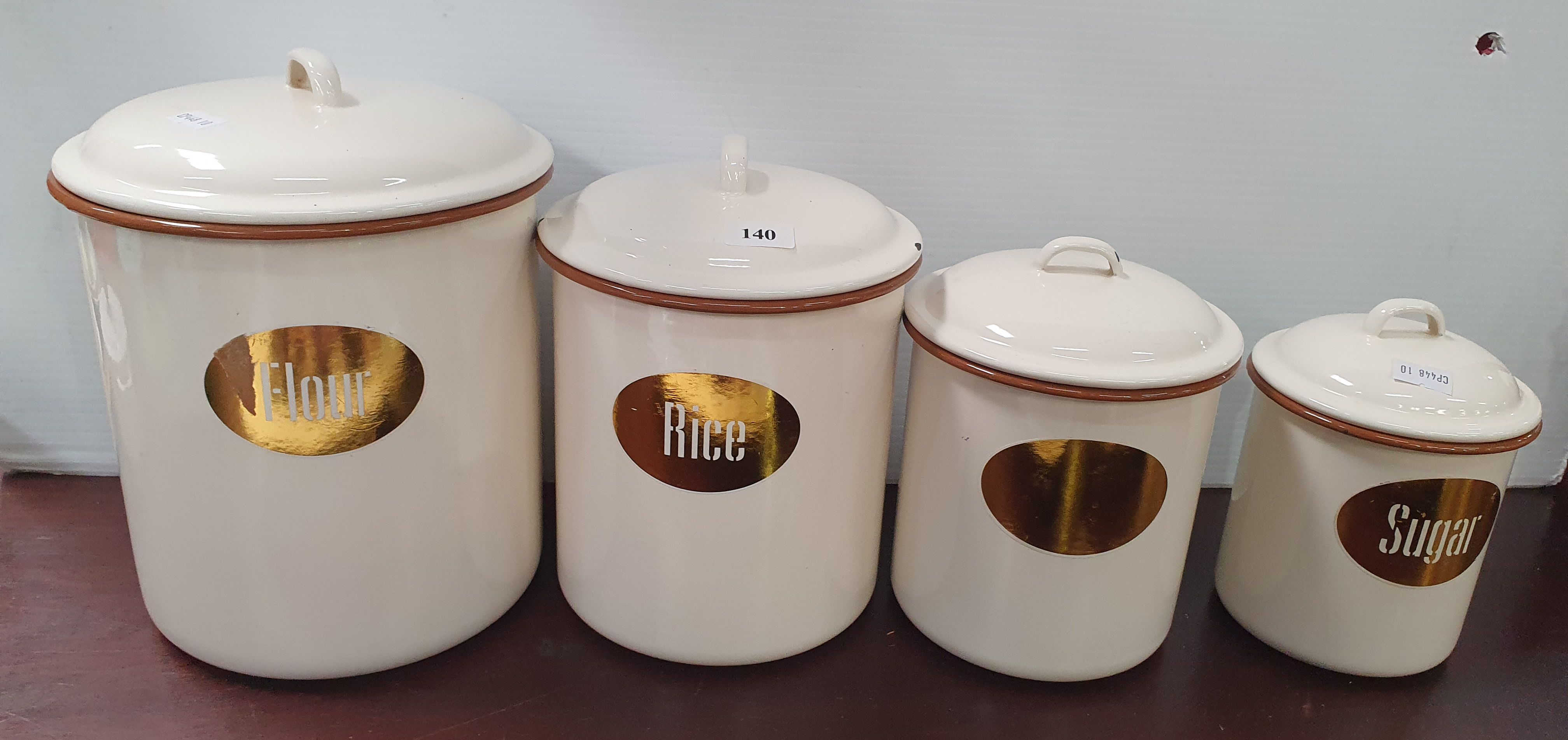 140 · A GRADUATING SET OF FOUR ENAMELLED CANISTERS
