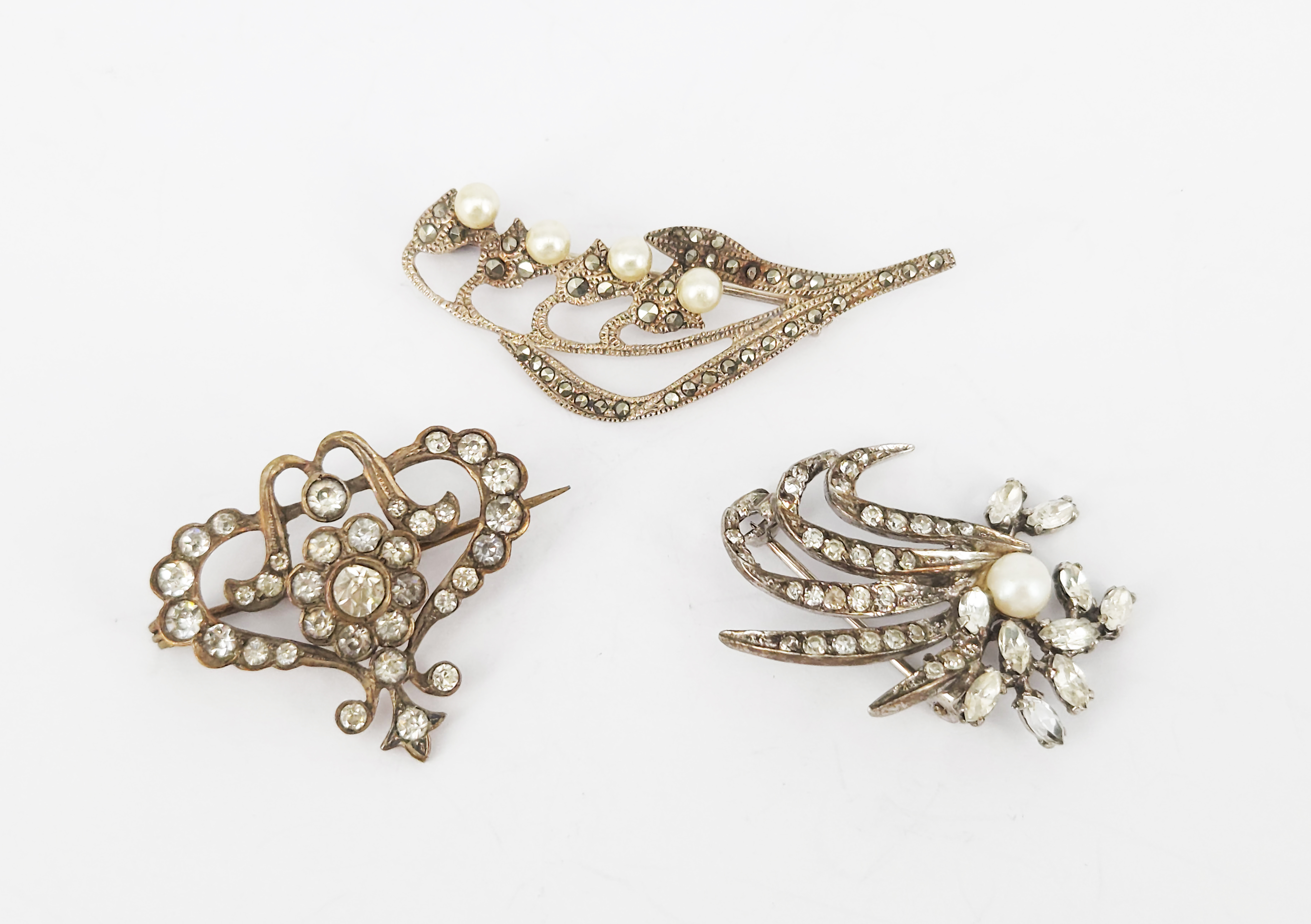 355 · THREE VINTAGE SILVER BROOCHES