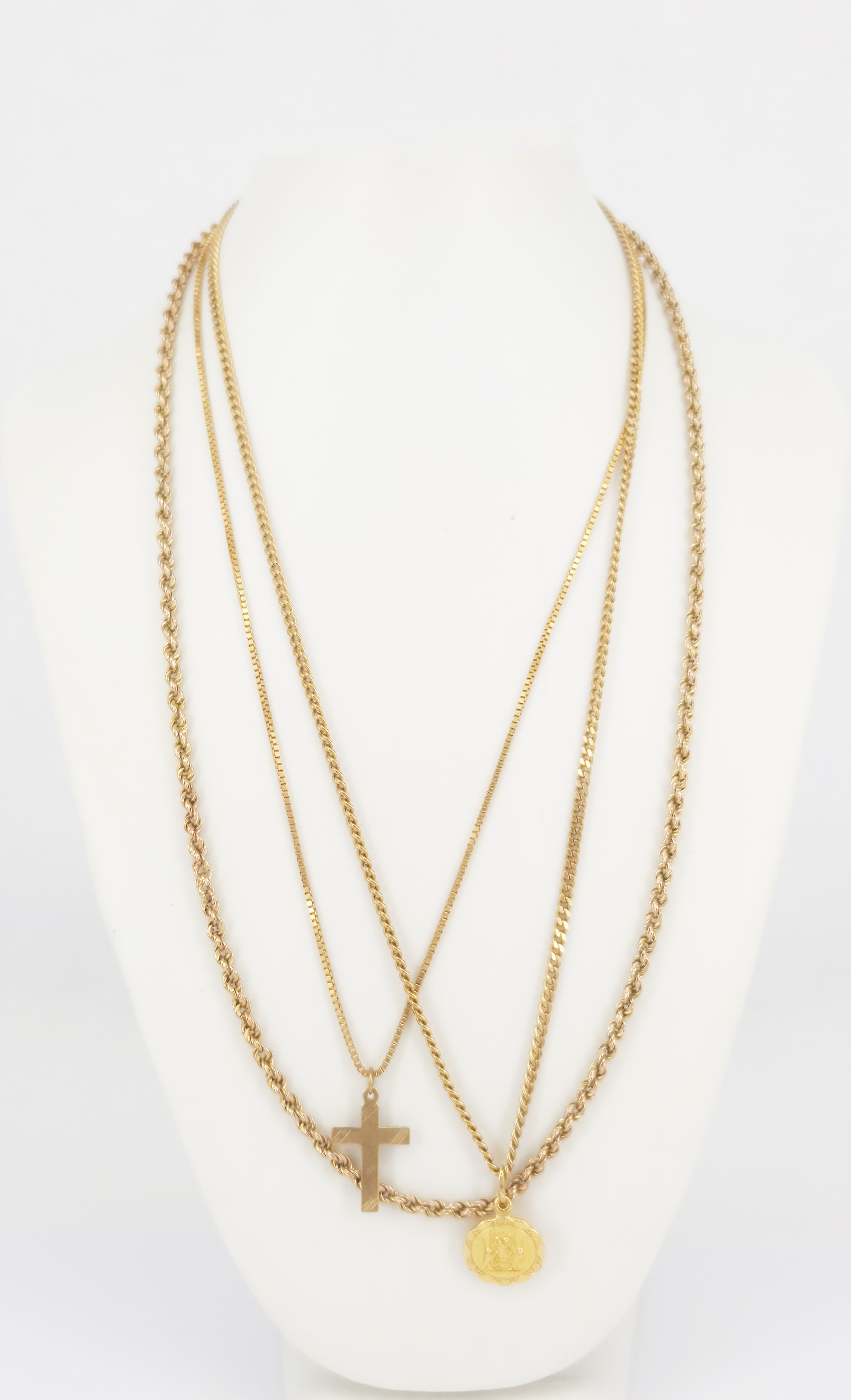 136 · THREE 9ct GOLD CHAINS