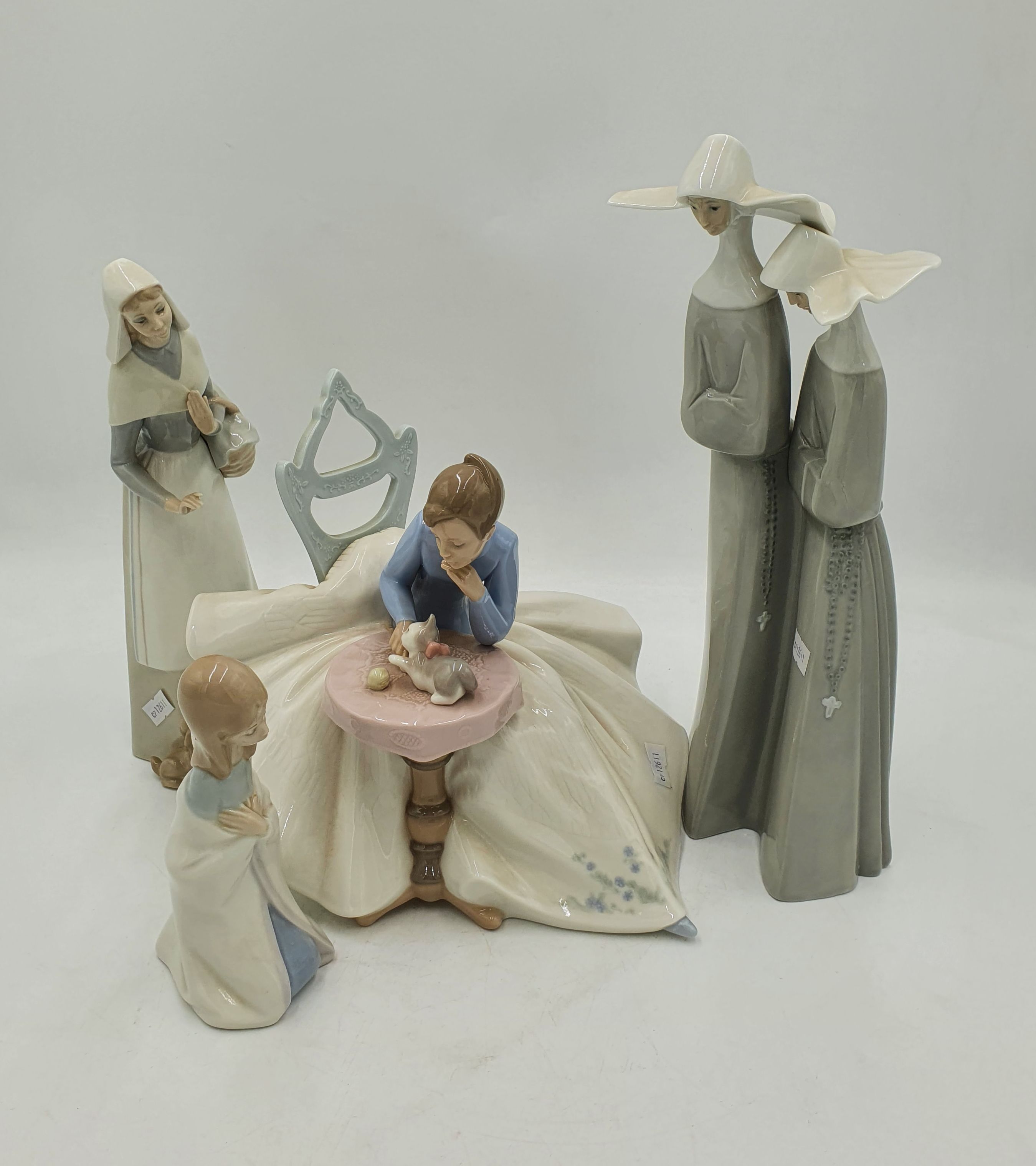 FOUR PORCELAIN FIGURES