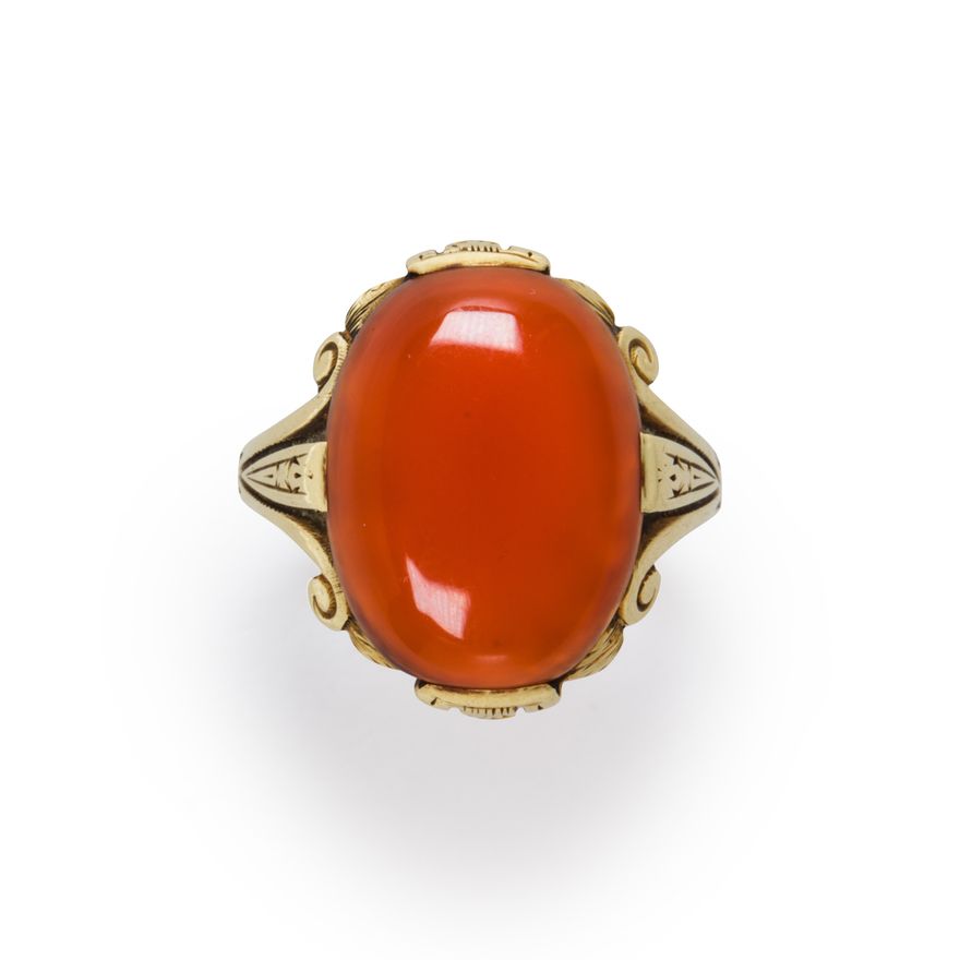 A carnelian and fourteen karat gold ring