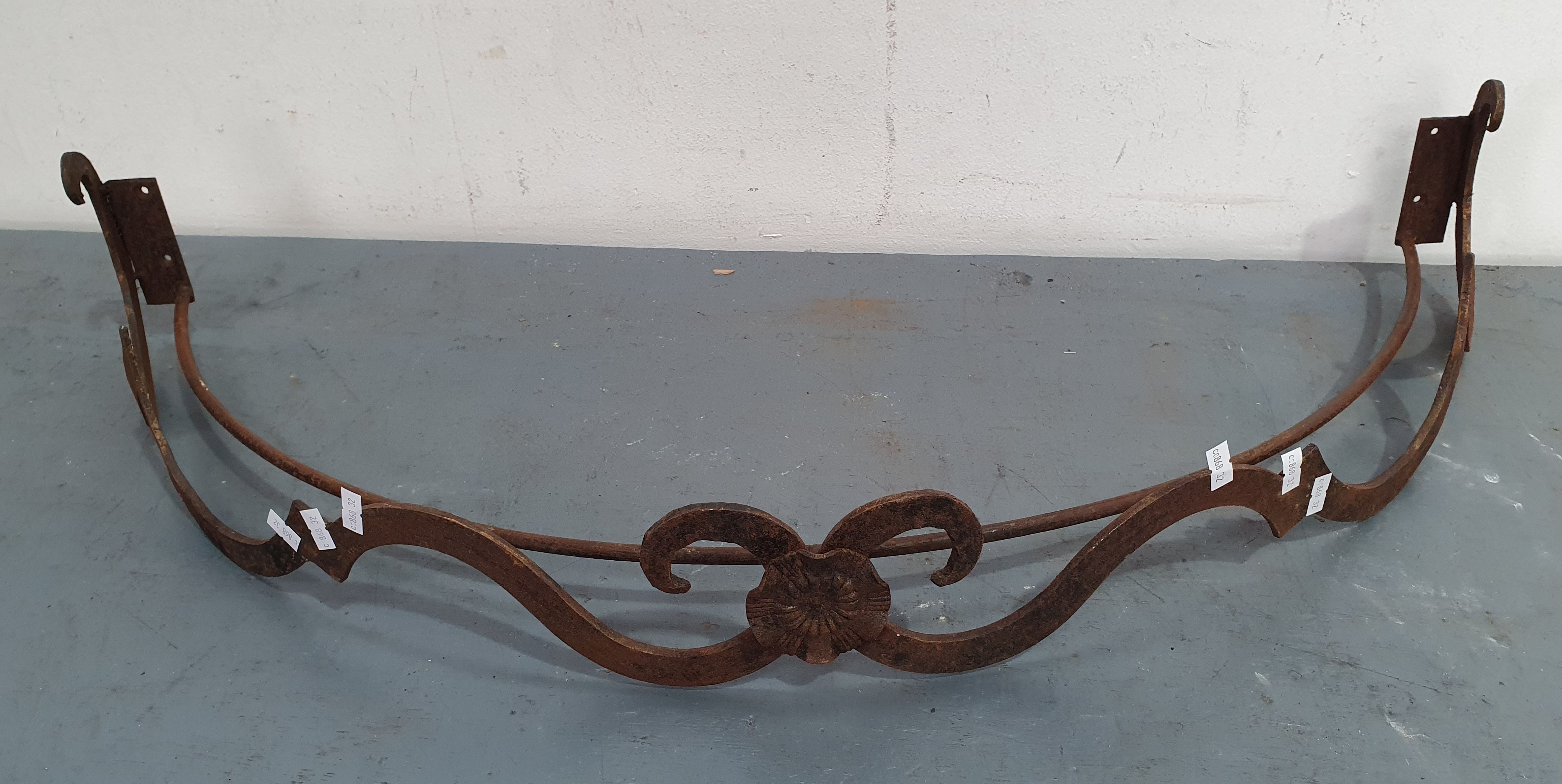 1180 · A CAST IRON WALL HANGING