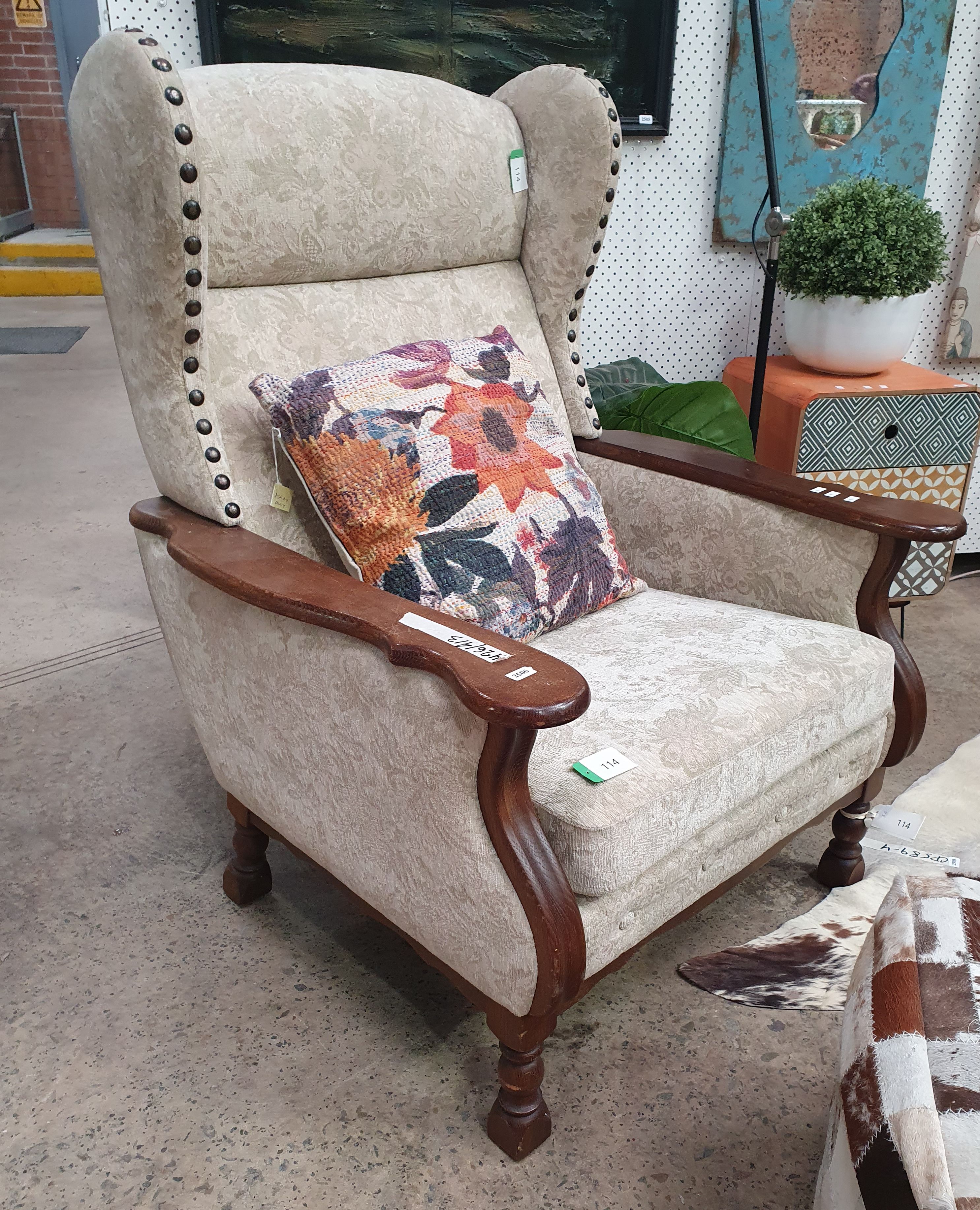 AN OAK ARMCHAIR