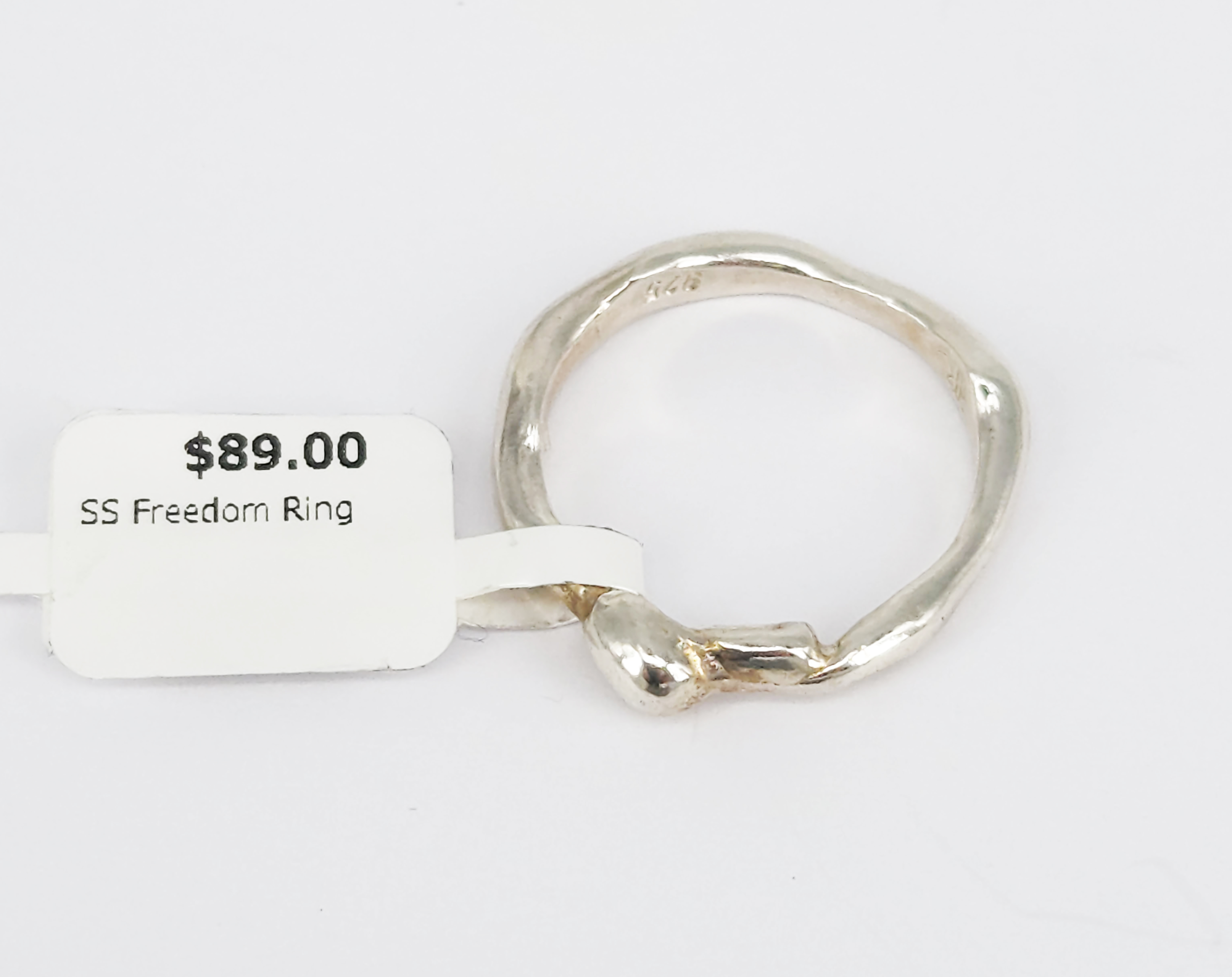 400 · A STERLING SILVER 'FREEDOM' FREE-FORM POURED RING