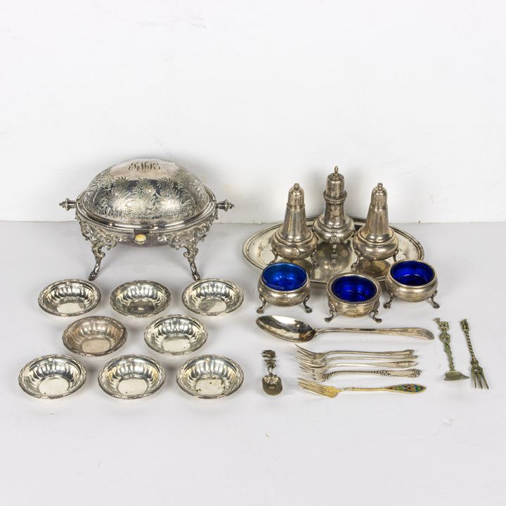 A lot of sterling table articles, including (2) Empire open salts and (2) shakers; a Fisher open salt and shaker; (8) Towle nut bowl...