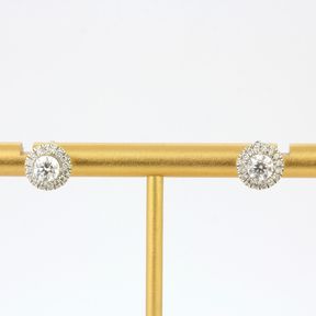 A pair of 18ct white gold diamond set halo earrings, approx. 1ct overall, Dia. 0.8cm.