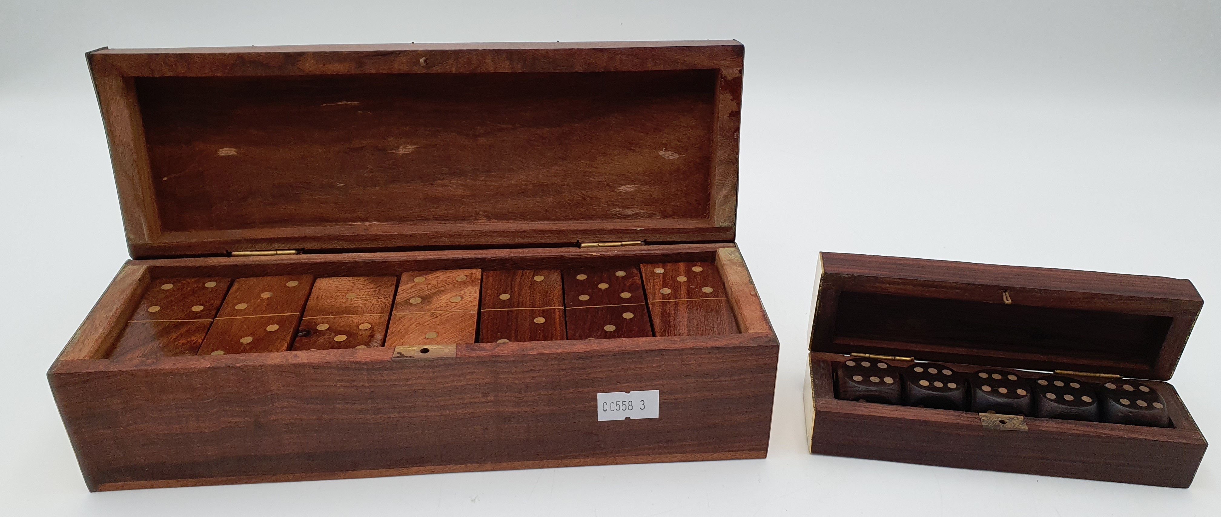526 · TWO GOOD WOODEN BRASS BOUND BOXES CONTAINING DOMINOS AND DICE