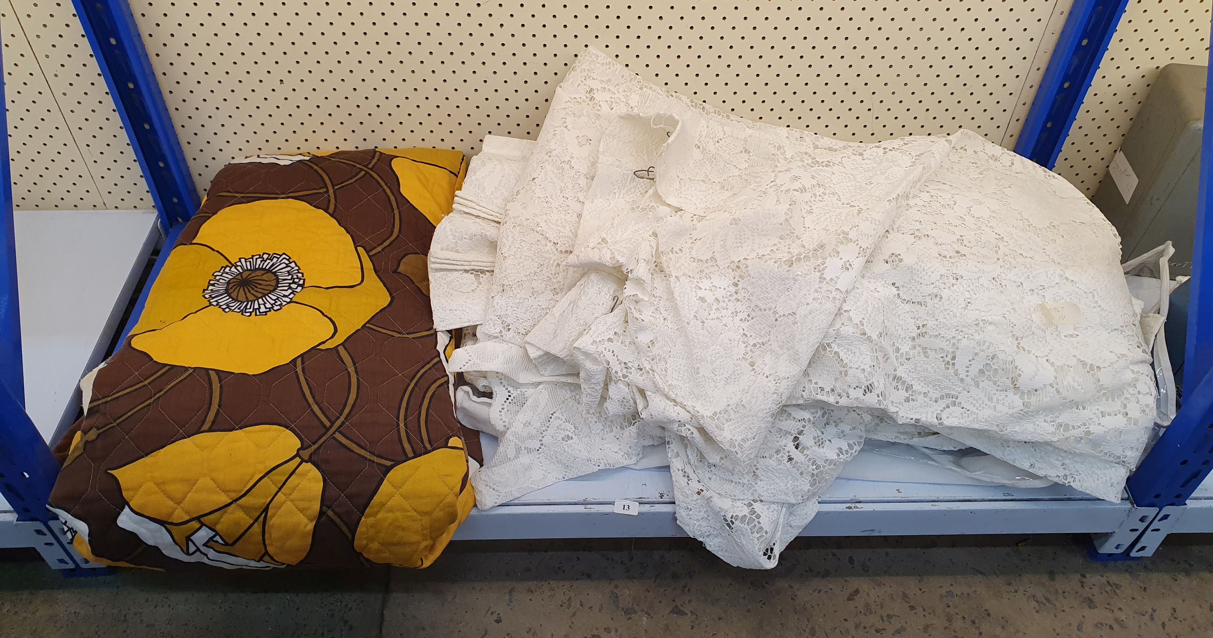 13 · A RETRO PRINT BEDCOVER AND A GROUP OF LACE CURTAINS