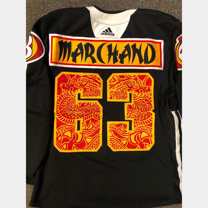 Practice worn & signed (in the middle of the 6) by the one and only Brad  Marchand during the Bruins' trip to China. Also have a certified letter  signed by Marchand stating