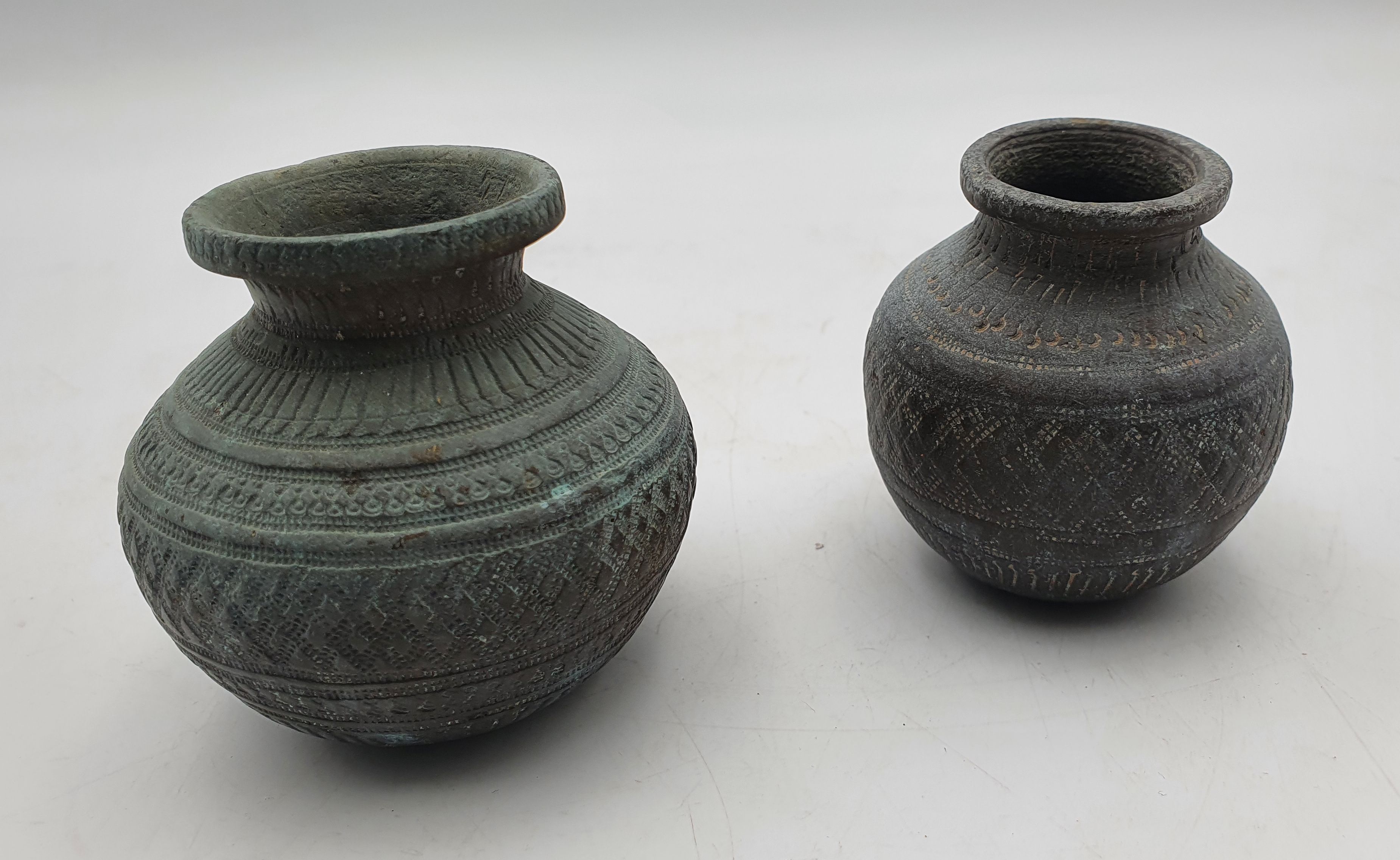 332 · A NEAR PAIR OF 18TH/19TH CENTURY PERSIAN BRONZE JARLETS