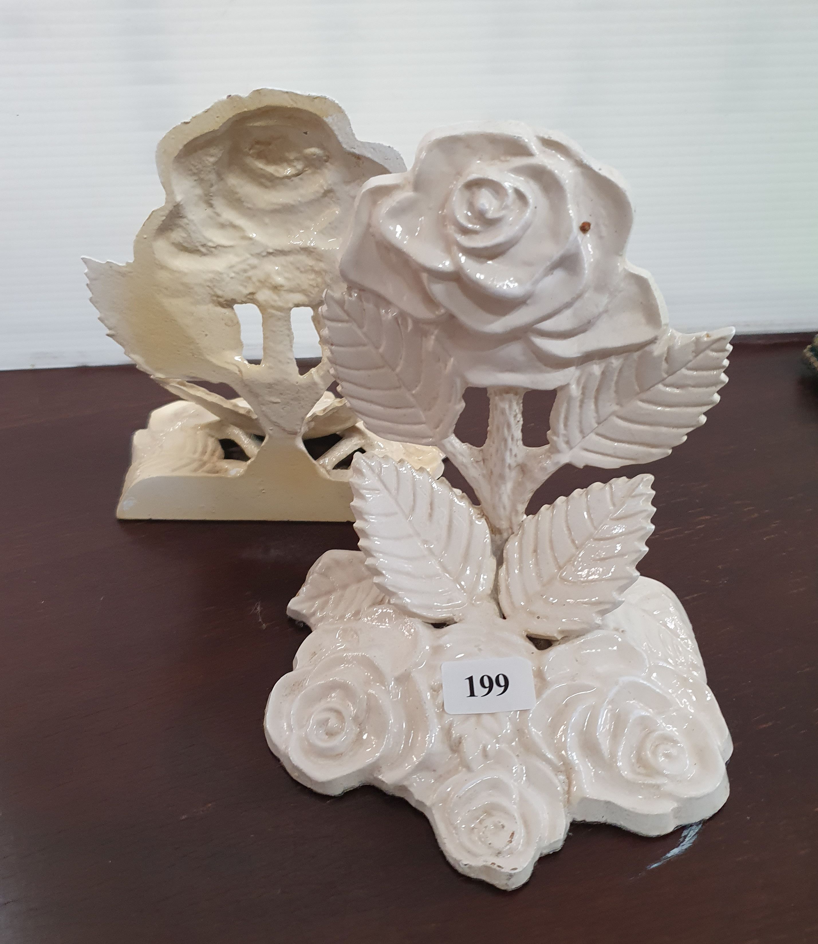 199 · A PAIR OF PAINTED METAL 'ROSE' BOOKENDS