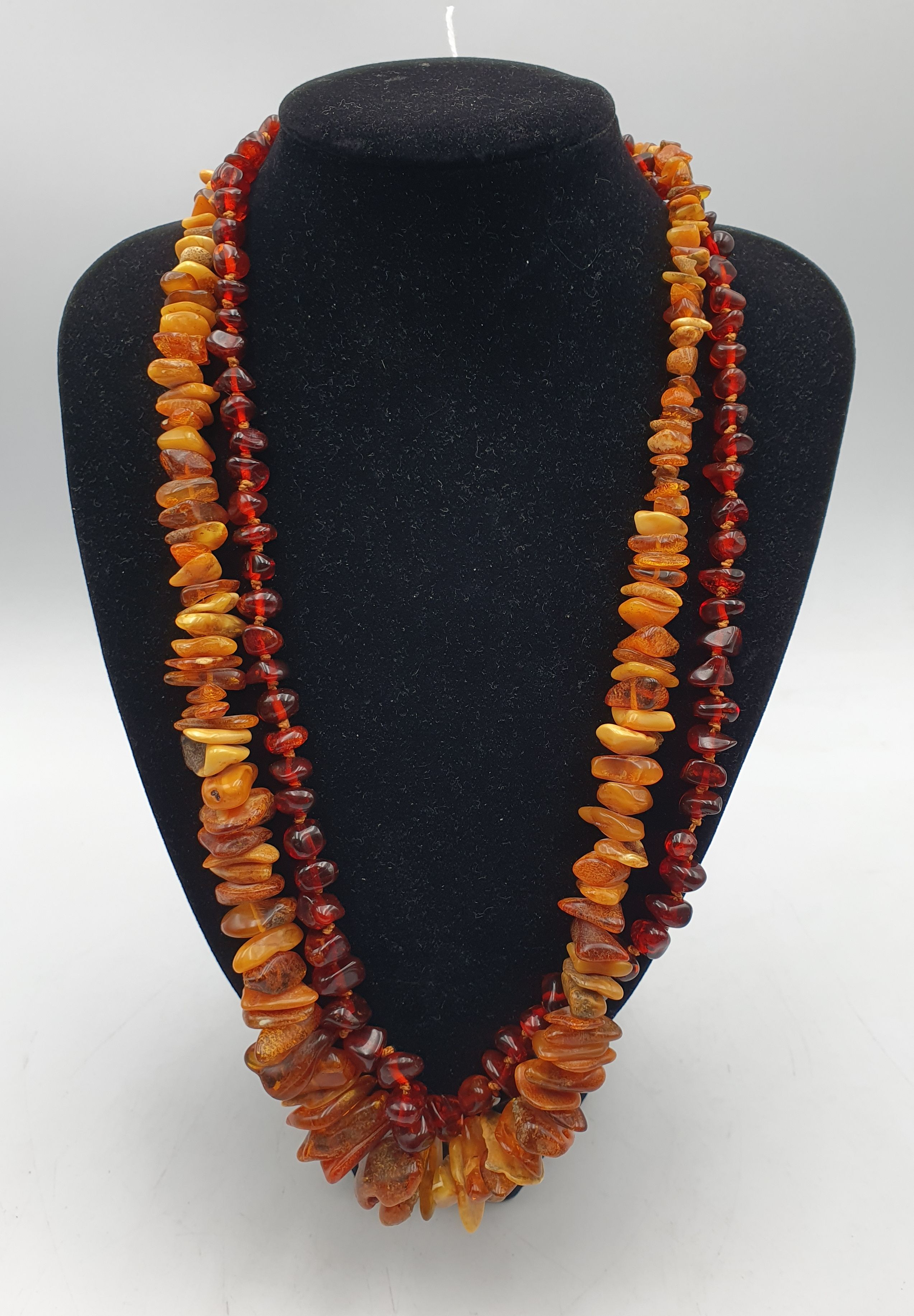 TWO AMBER NECKLACES