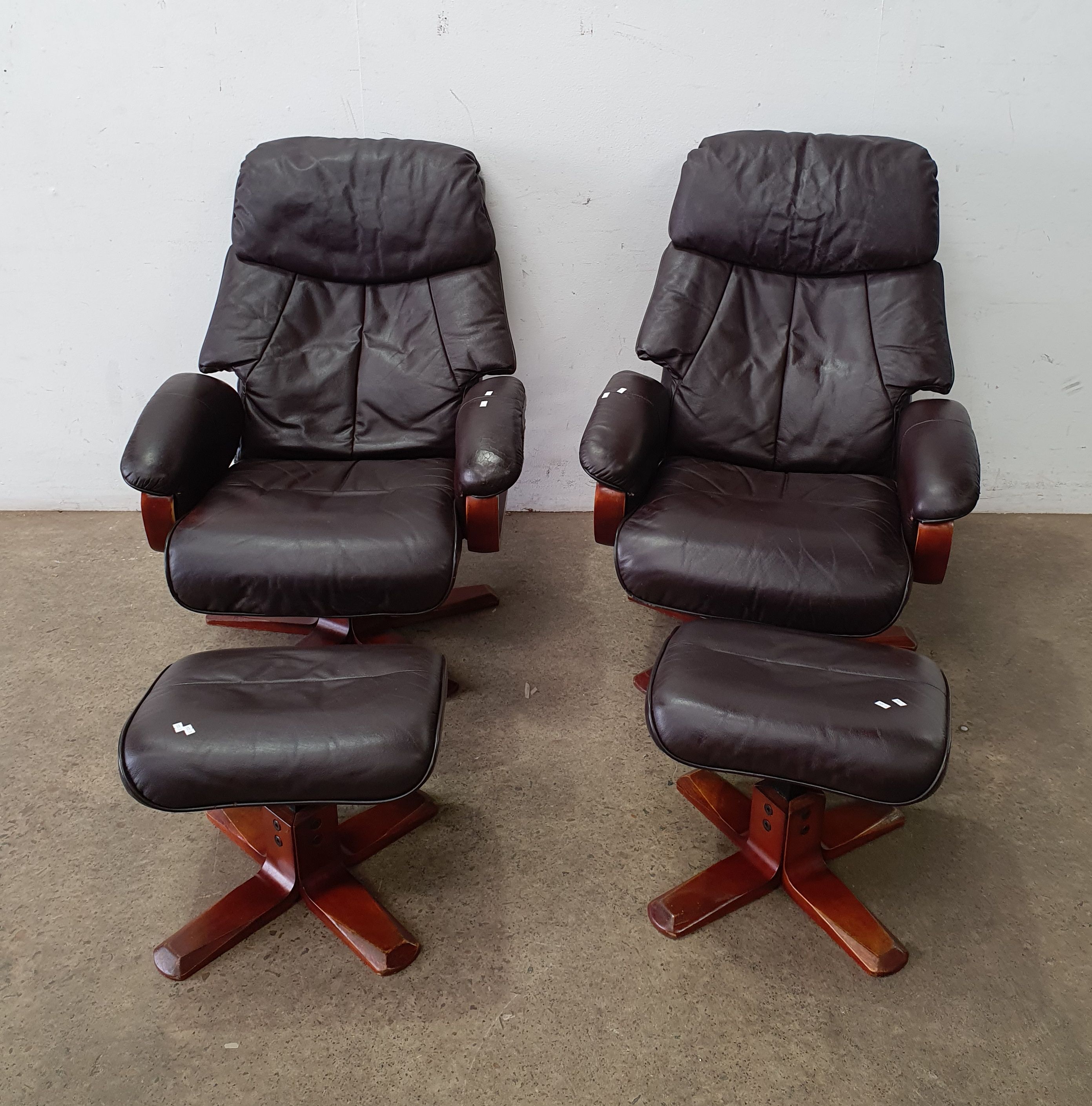 A Pair Of Leather Swivel Chairs