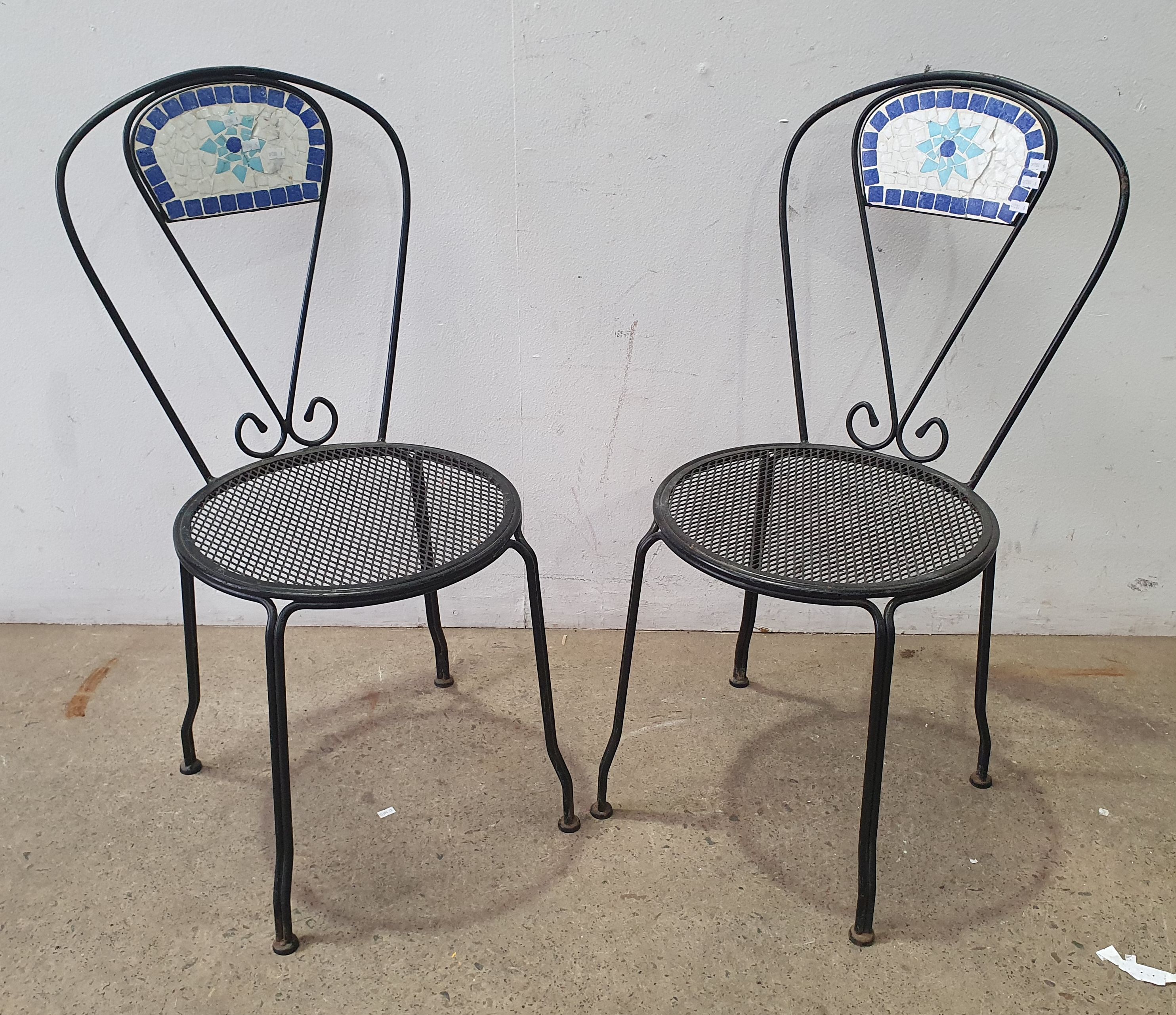 A Pair Of Metal Chairs