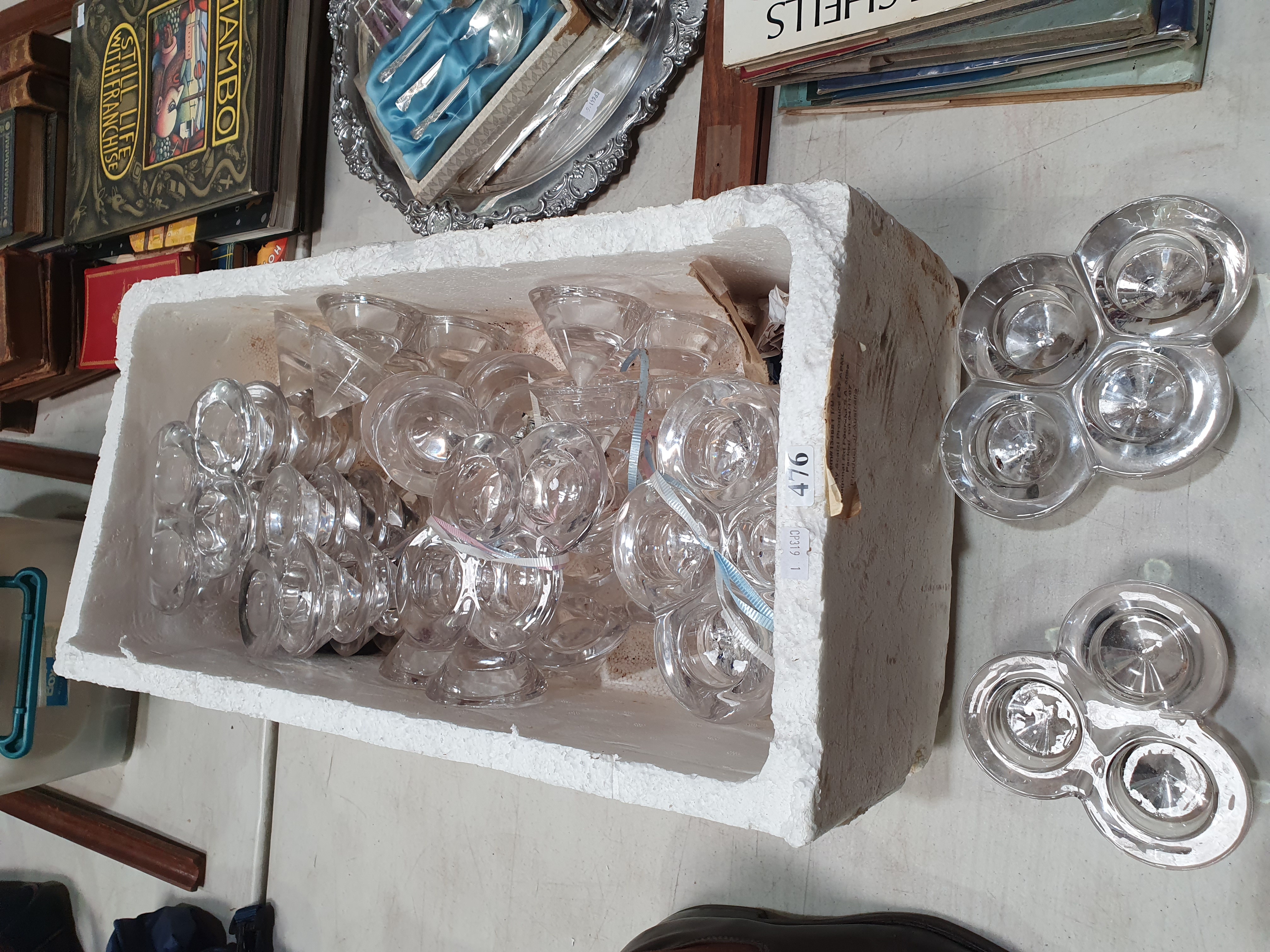 476 · A BOX OF GLASS CANDLE HOLDERS