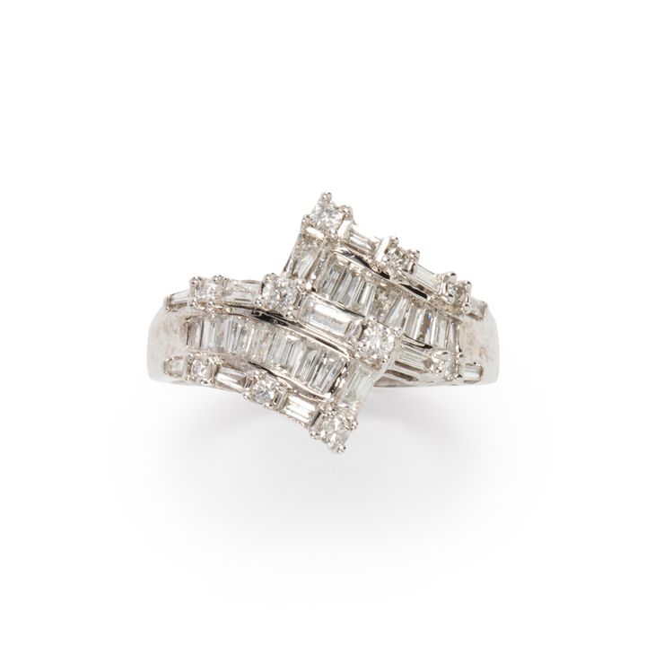 A diamond and fourteen karat white gold ring