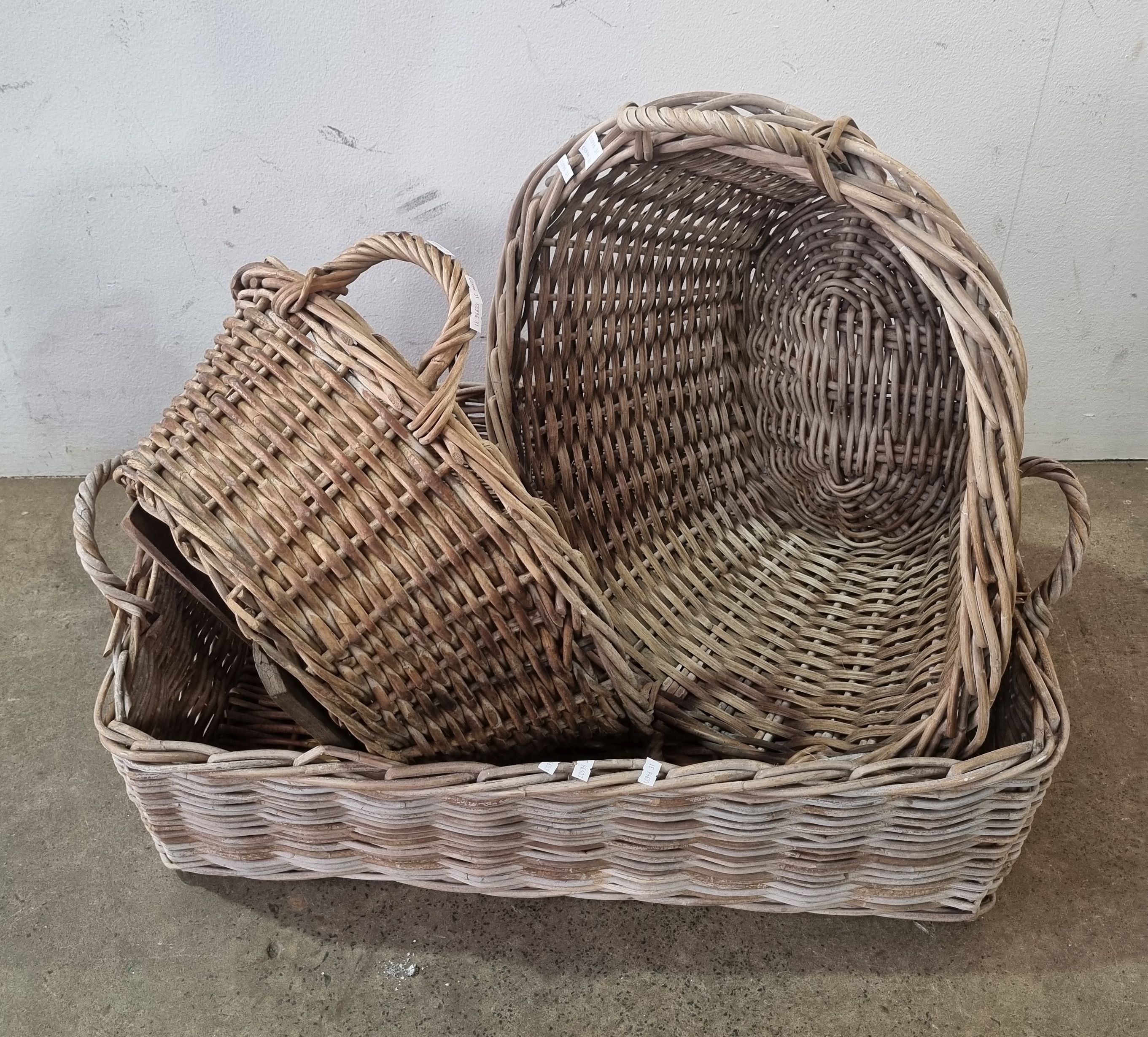 1051 · A GROUP OF CANE BASKETS
