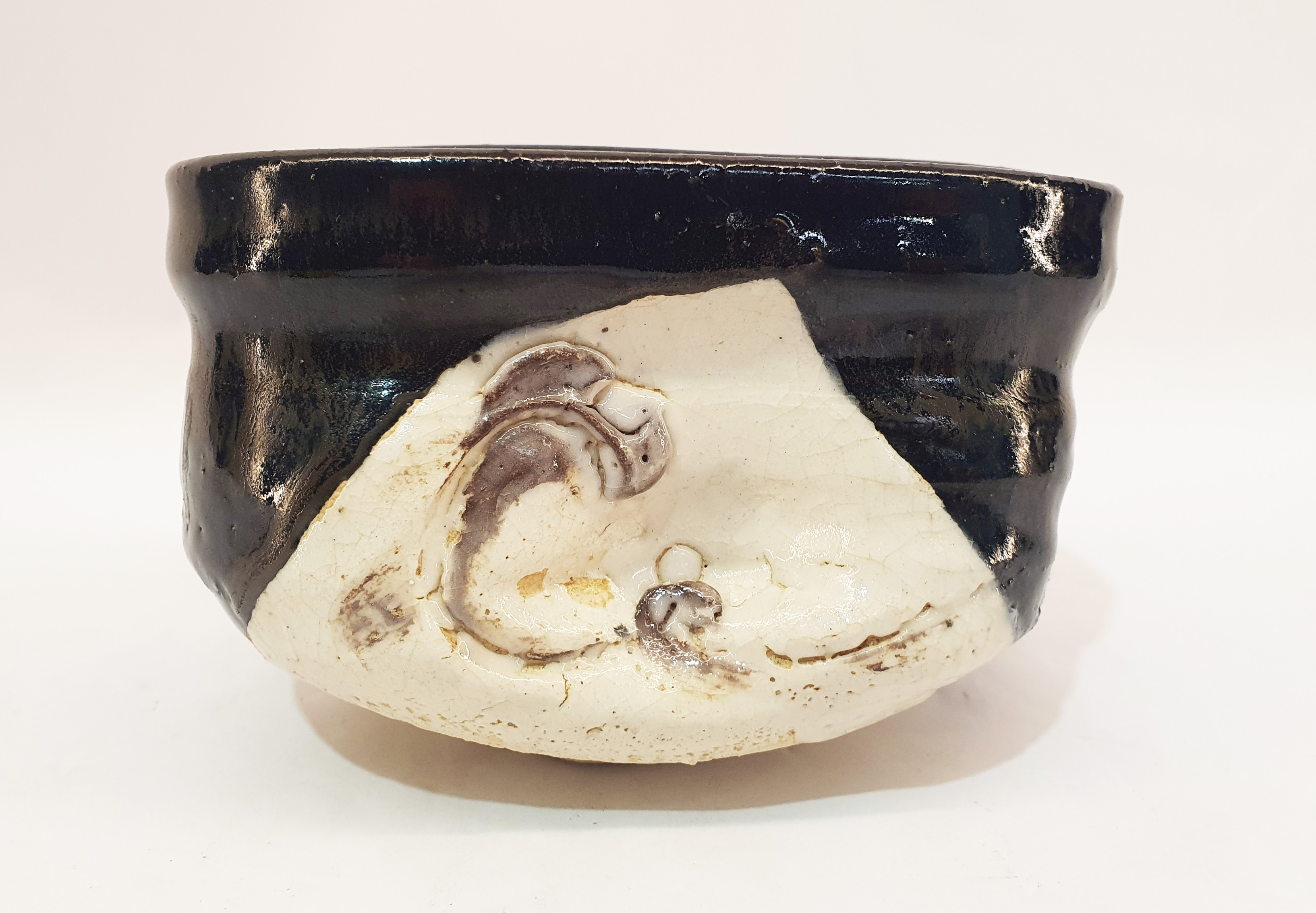 A Japanese Ceramic Kuro Oribe Chawan Tea Bowl