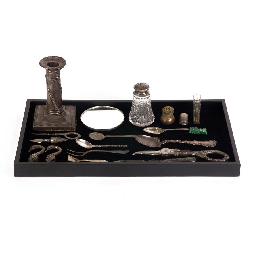 One bag of silver, including mirror, scent bottle, thimble and various parts.