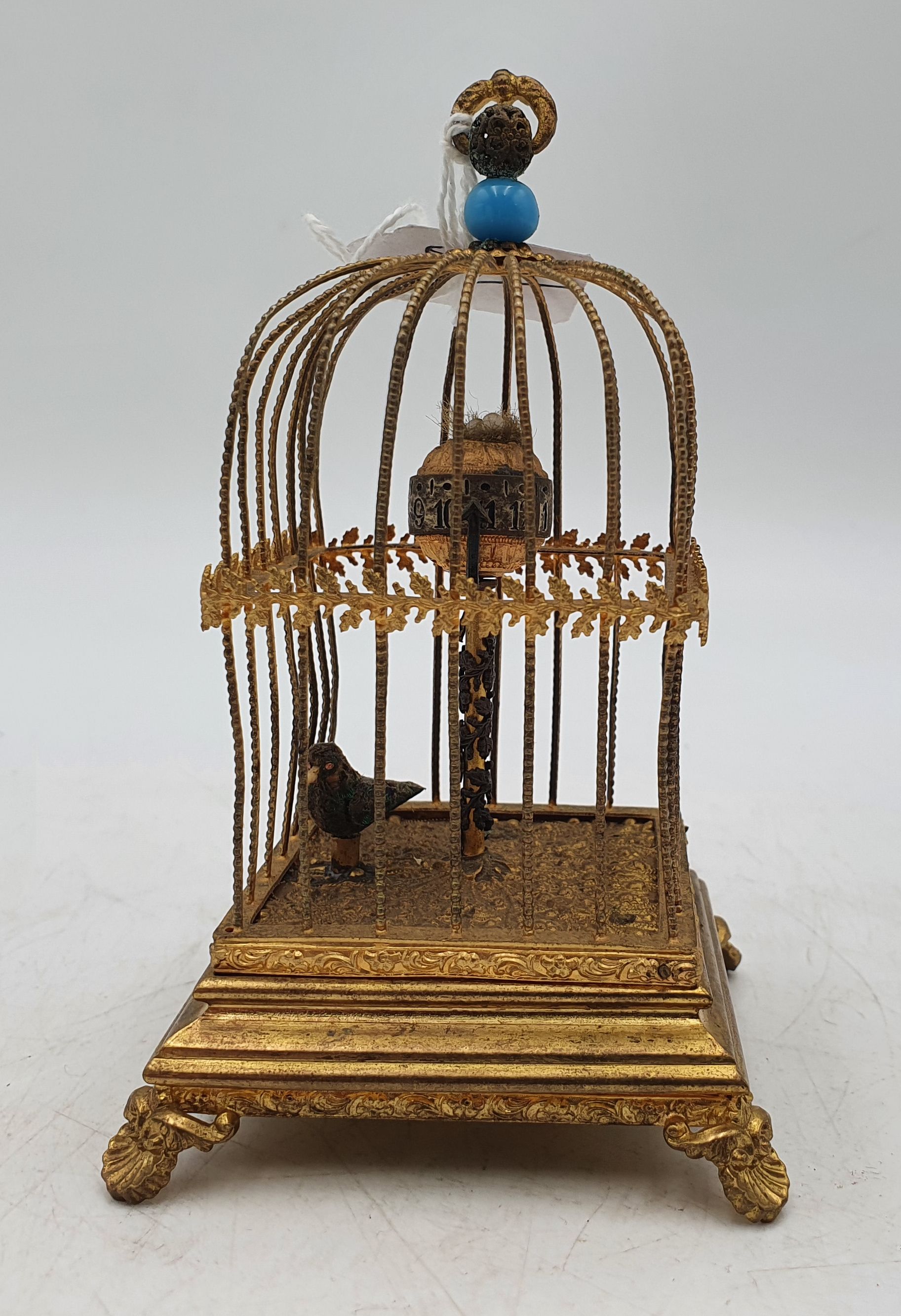 574 · A MECHANICAL SINGING BIRD IN A CAGE AUTOMATON