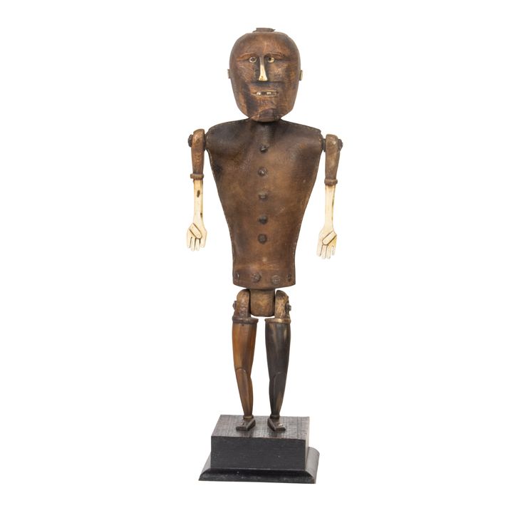 A Folk Art carved wood, bone, horn and leather figure of a man