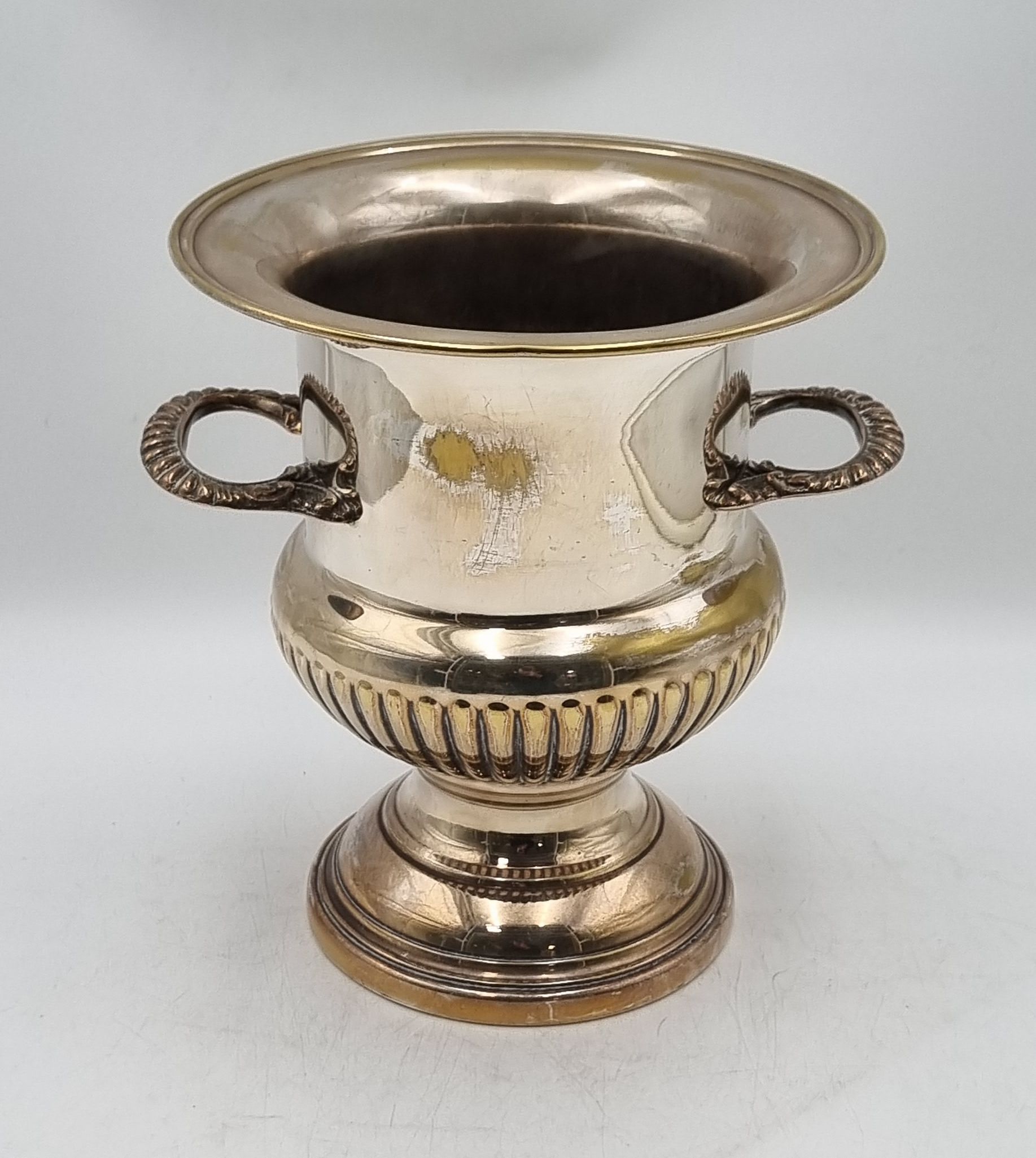 A SILVER PLATED TWIN-HANDLED CHAMPAGNE COOLER