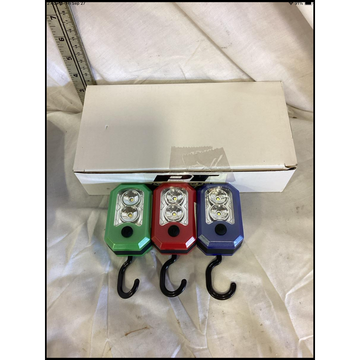 Buying (6) Performance Tools LED Mini Flash Lights w/ Hooks (2 Green, 2 Red, 2 Blue)