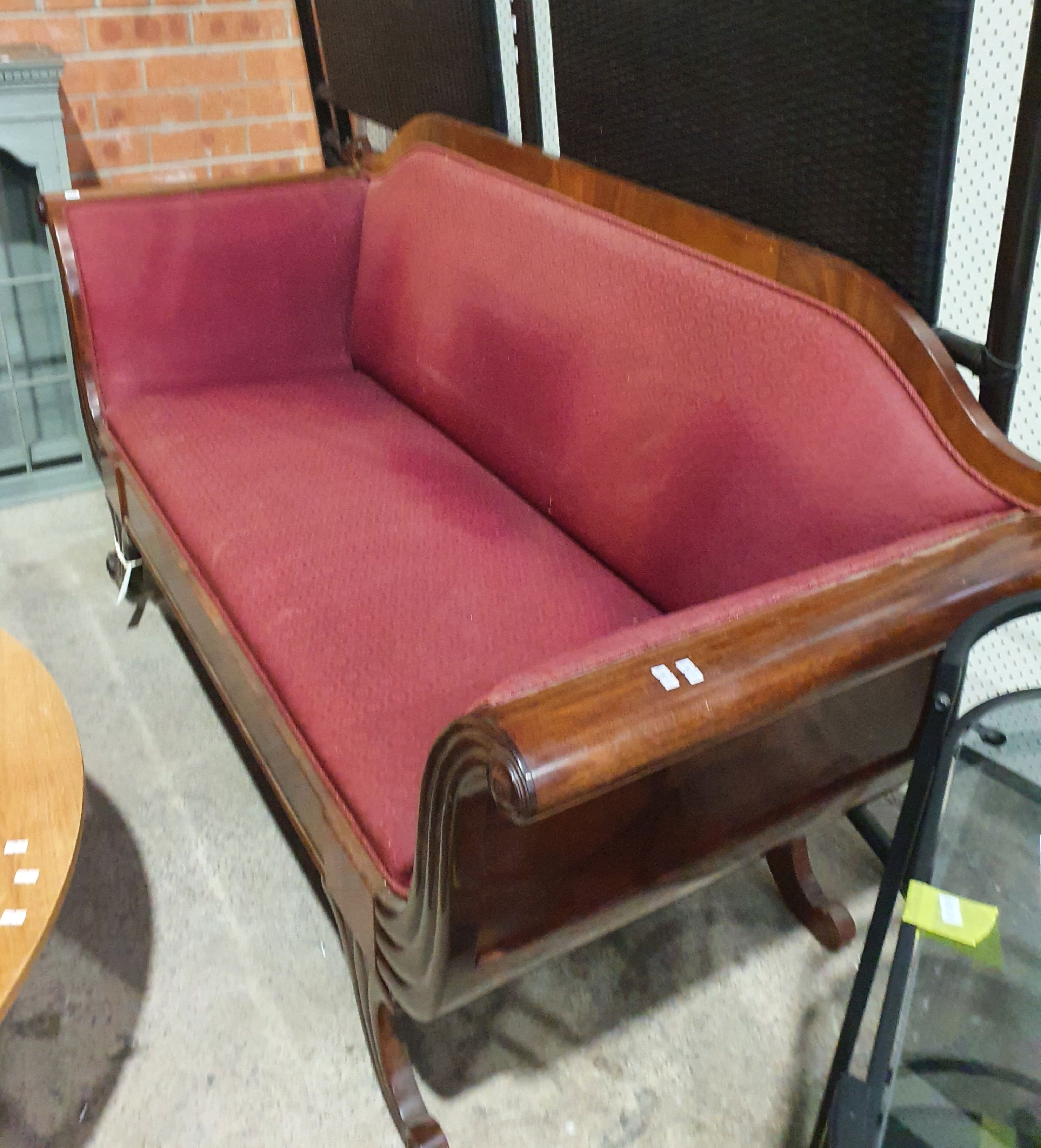 A MAHOGANY DOUBLE ROLL ARM SETTEE