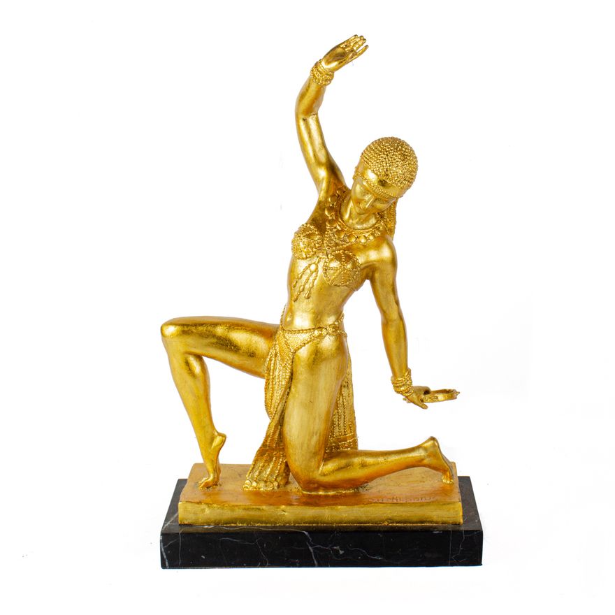 An Art Deco style gilt metal figure of a dancer after a model by Demetre Chiparus