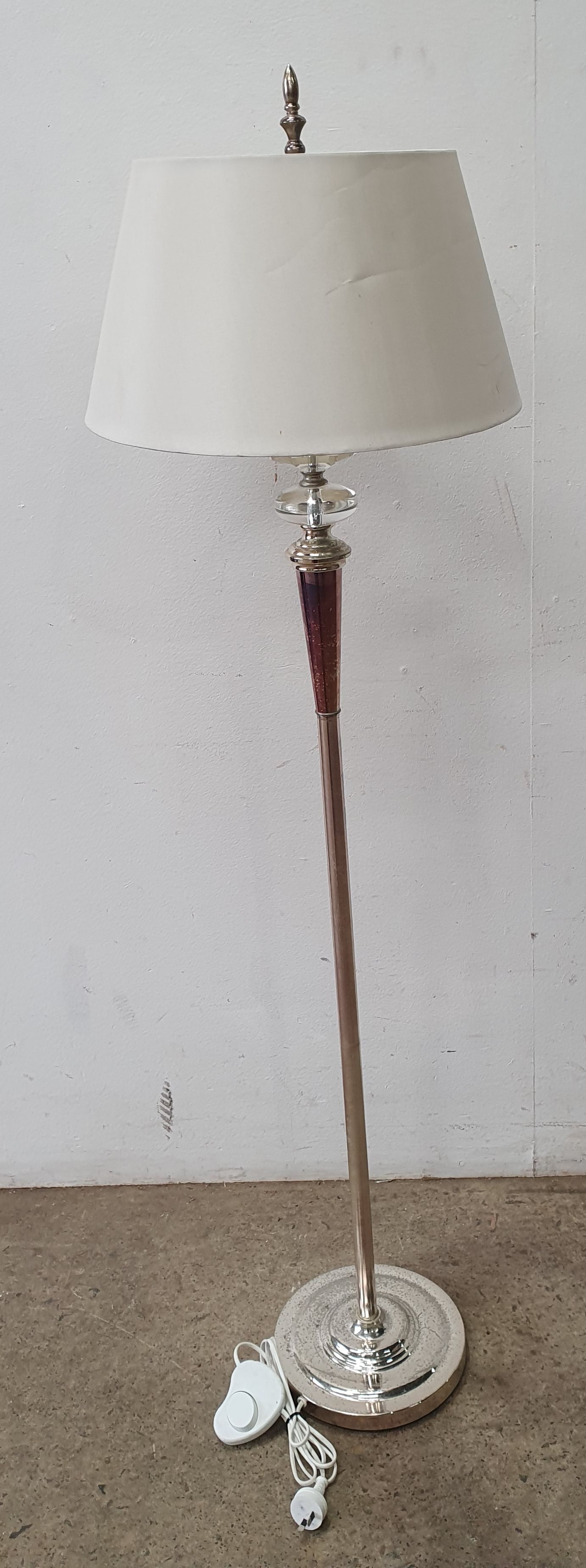 A Glass And Metal Standard Lamp