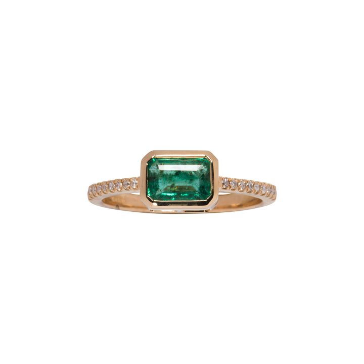 An emerald, diamond and 14k gold ring