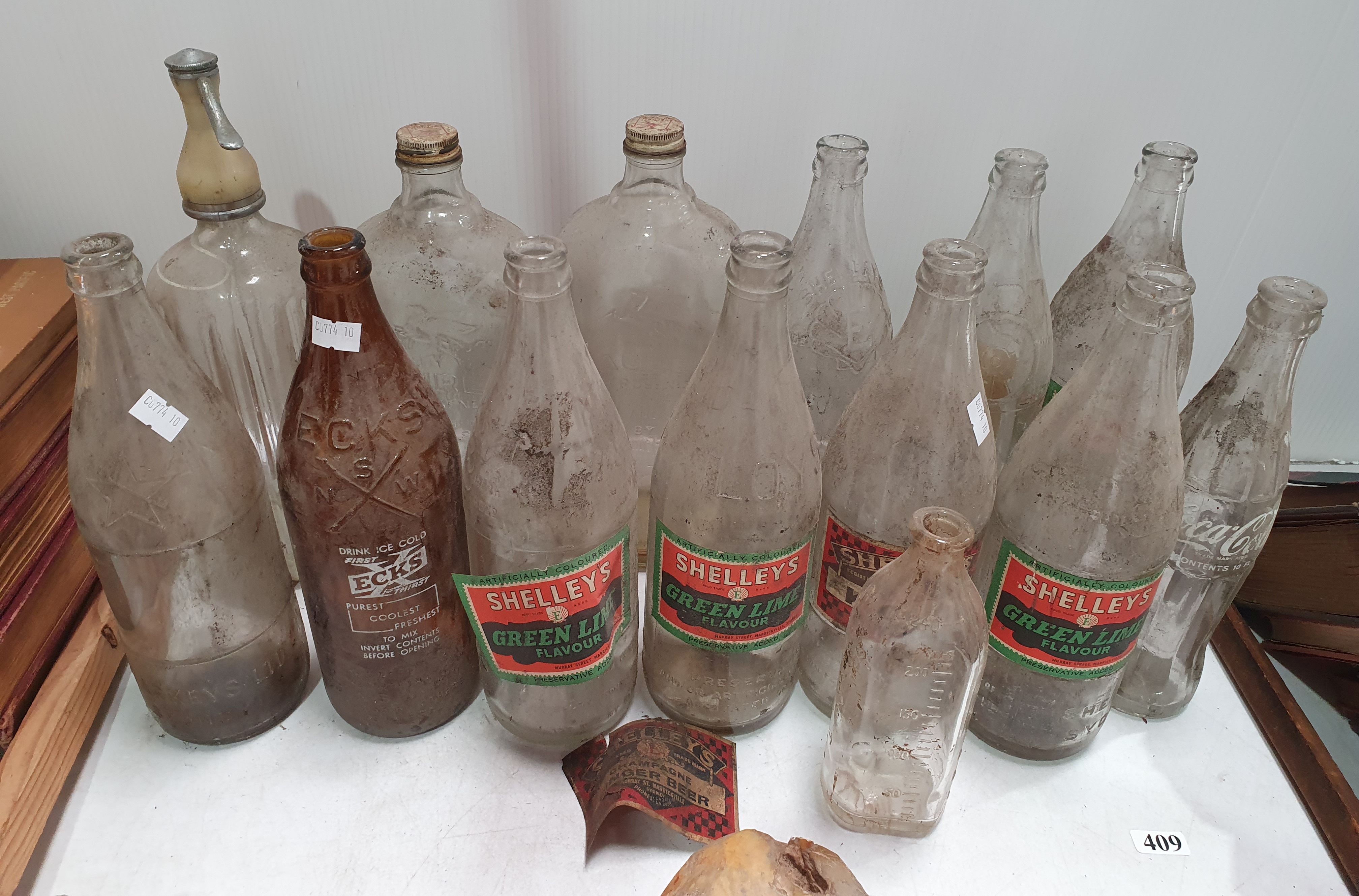 409 · A COLLECTION OF 20th CENTURY SOFT DRINK BOTTLES AND OTHERS