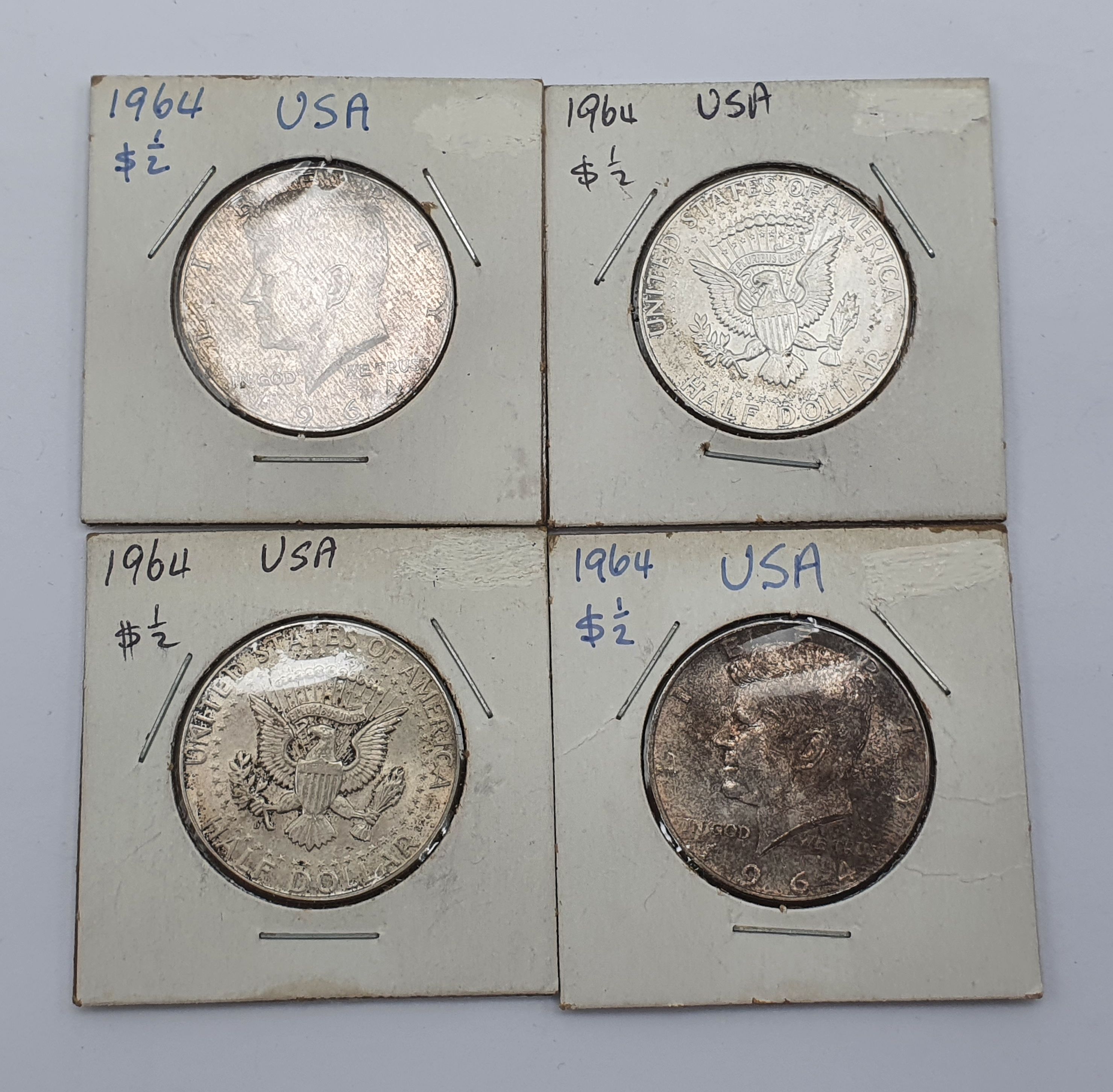 FOUR AMERICAN STERLING SILVER 'KENNEDY' HALF DOLLARS
