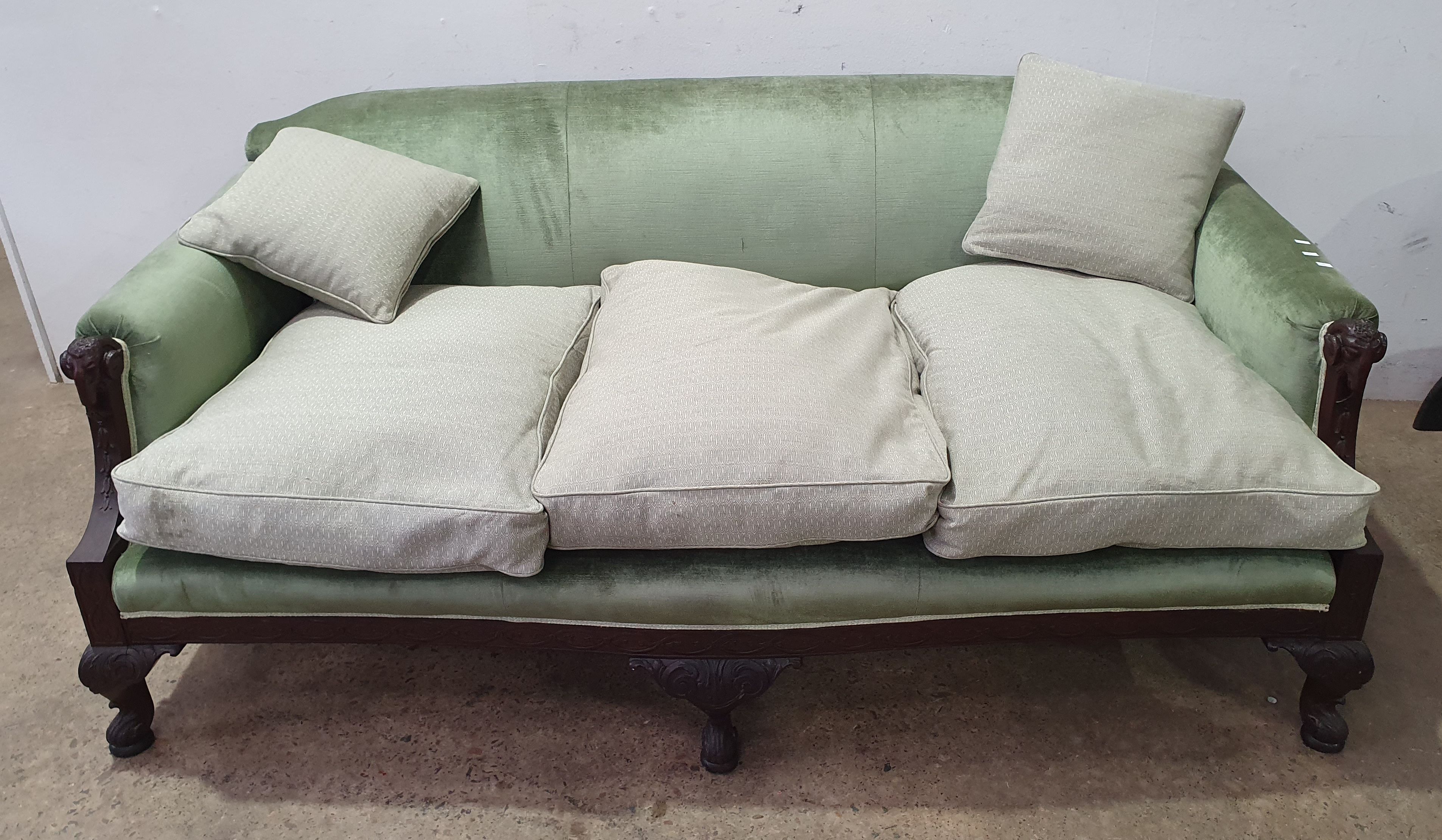 2028 · A CARVED CONTINENTAL THREE SEAT SOFA IN GREEN VELVET UPHOLSTERY