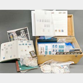 A quantity of stamp albums and loose stamps.