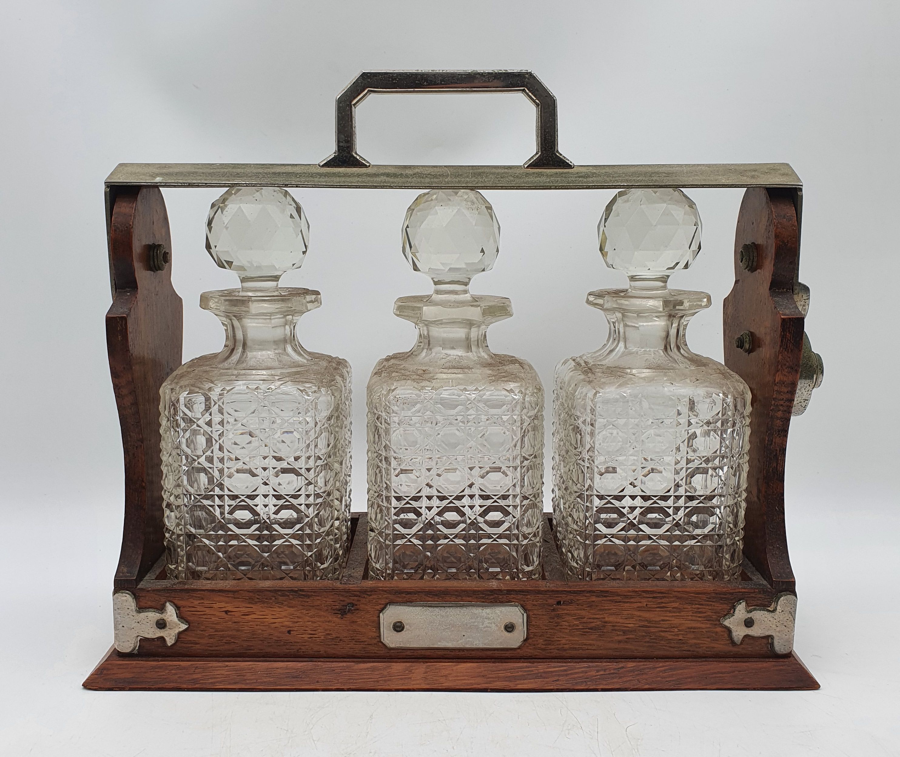 543 · A THREE BOTTLE OAK TANTALUS