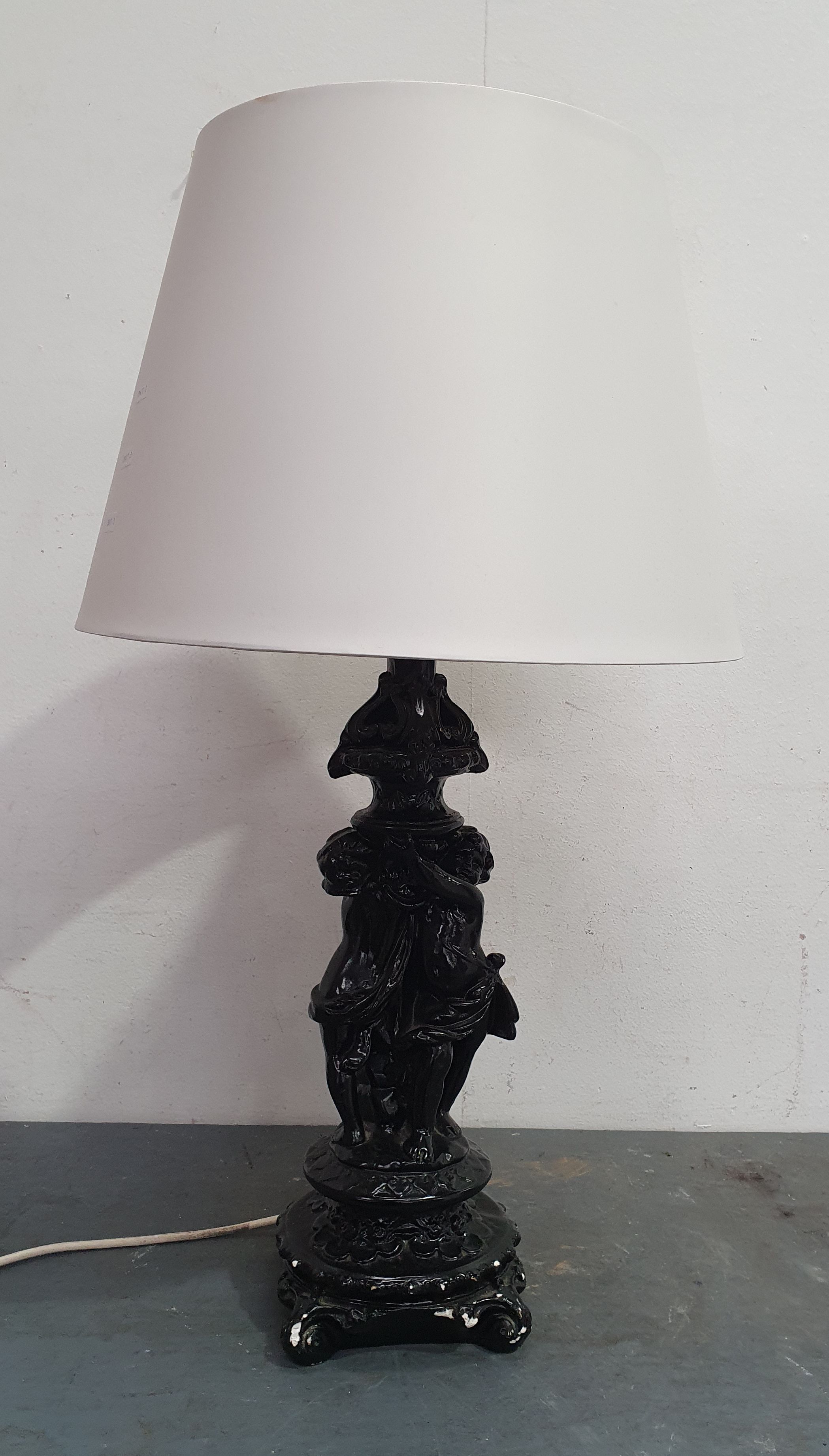 A Decorative Black Painted Table Lamp