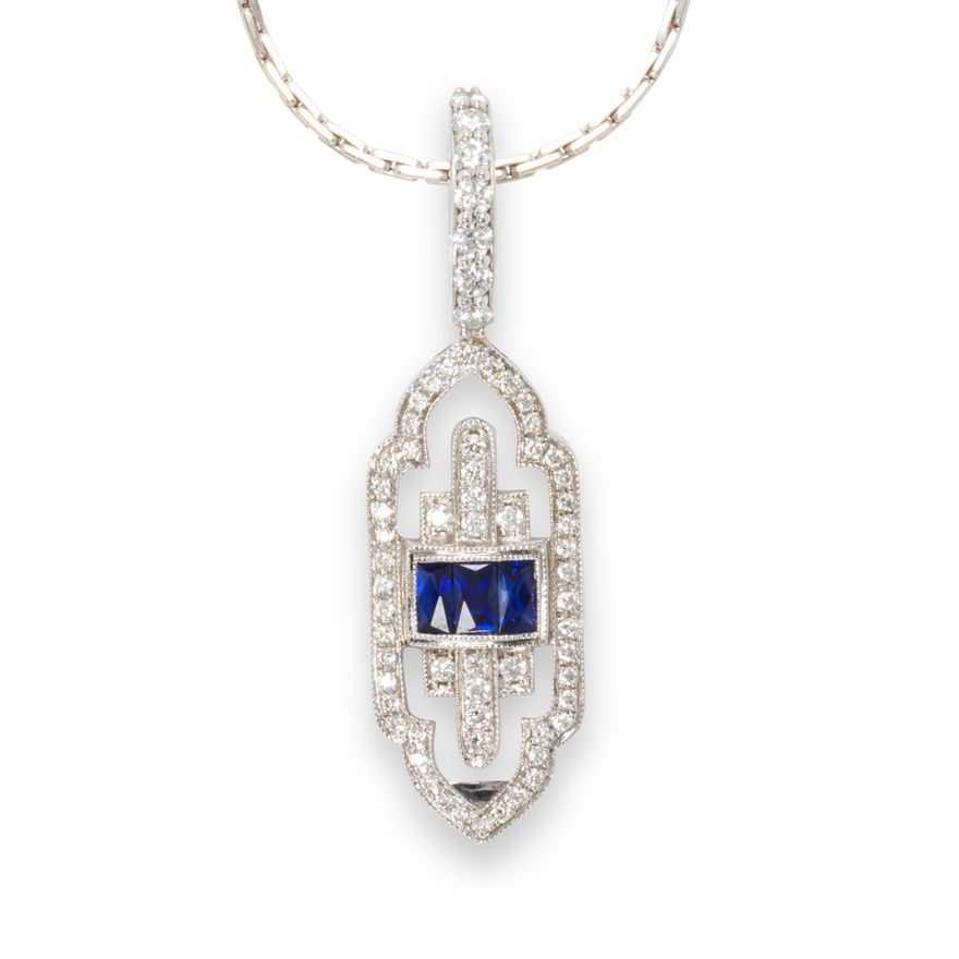 A sapphire, diamond and fourteen karat white gold ring