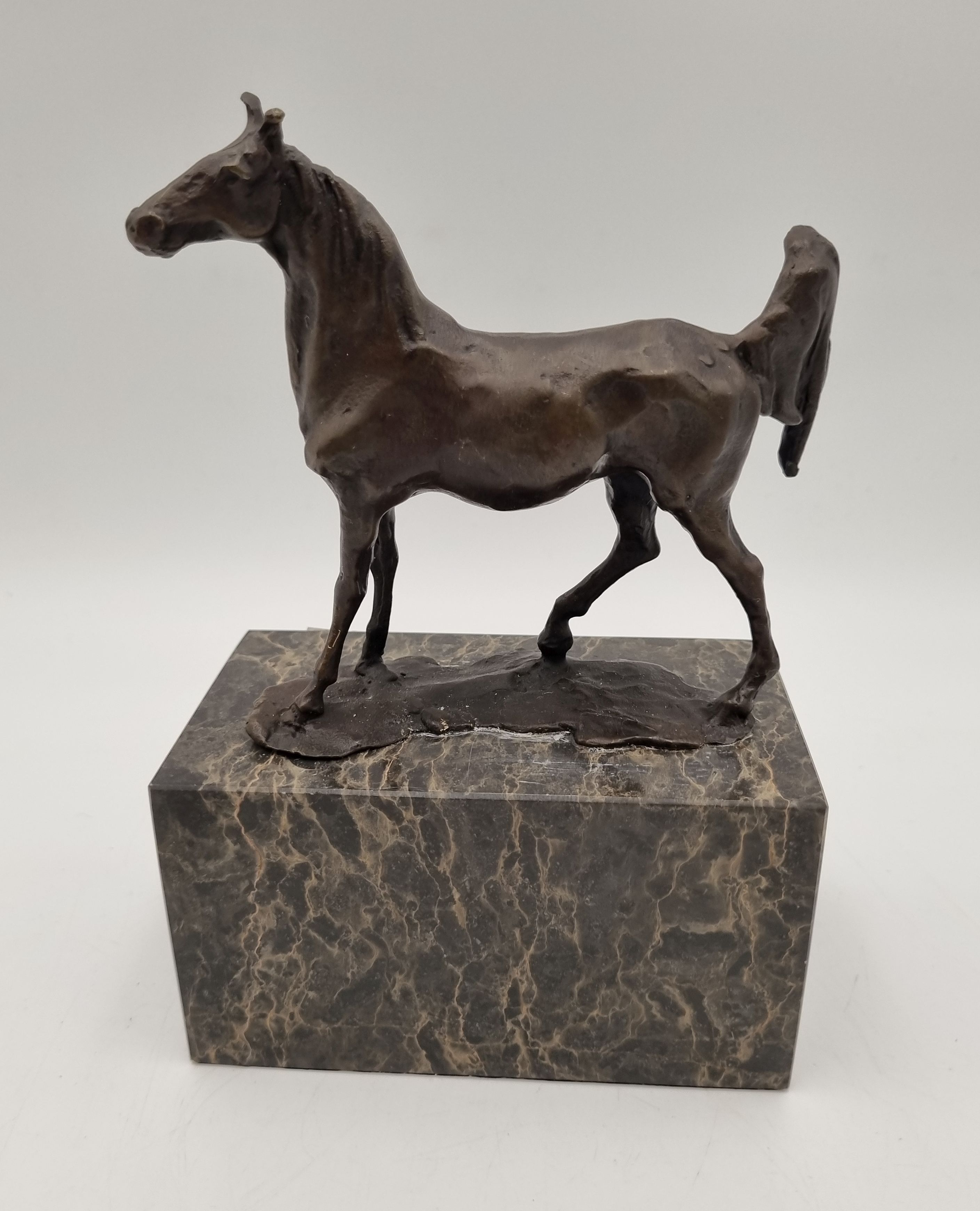 612 · A BRONZED FIGURE OF A HORSE