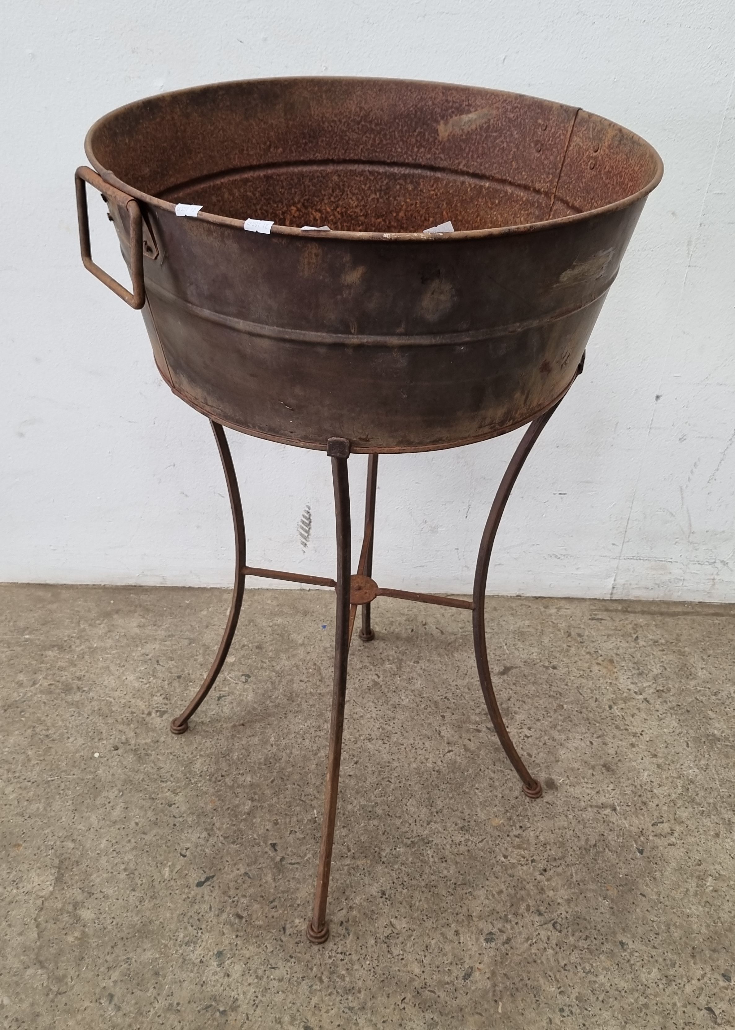 A Metal Basin On A Stand