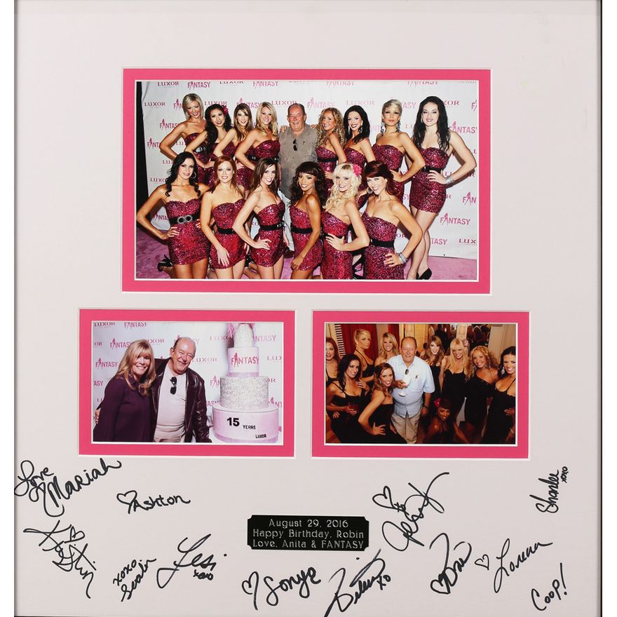 Framed photographs of Robin Leach and the cast of Fantasy