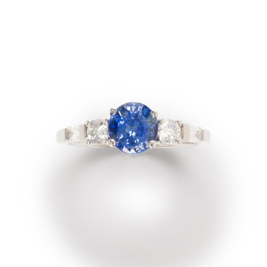 A sapphire, diamond and eighteen karat white gold ring