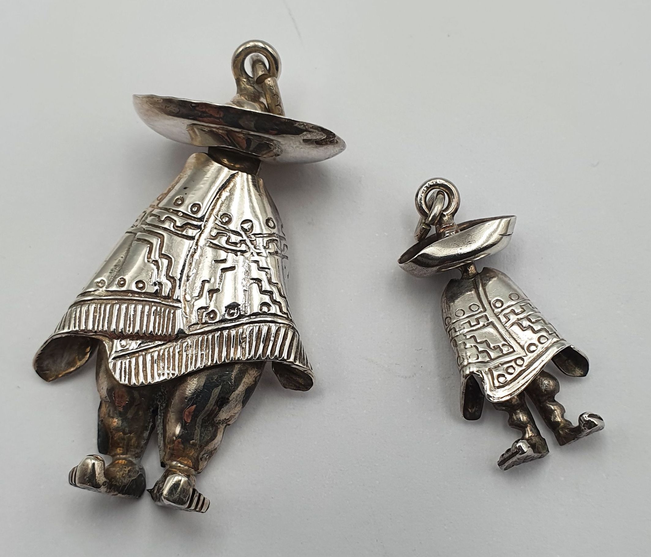 TWO VINTAGE MEXICAN SILVER PENDANTS