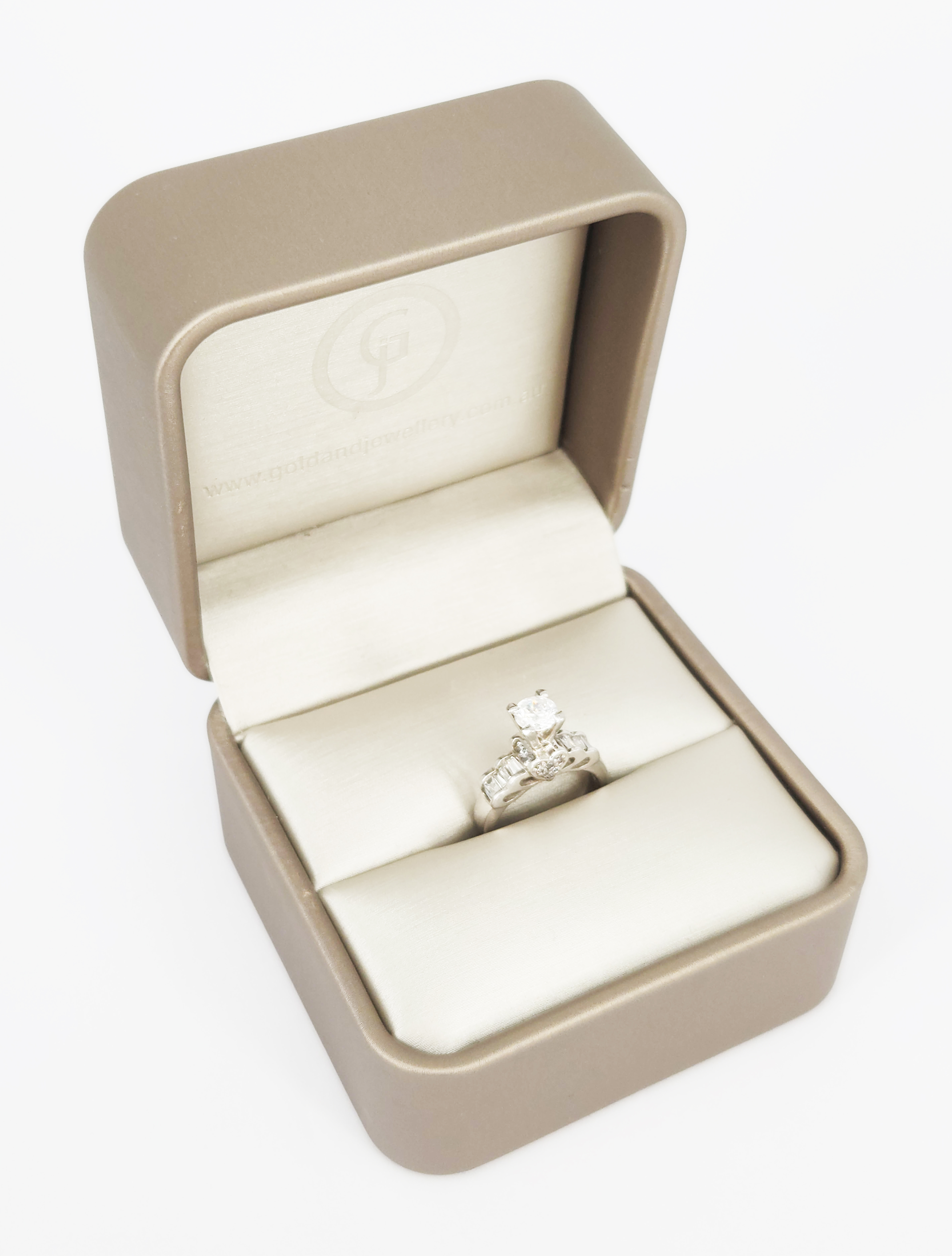A White Gold And Stone Set Solitaire Ring