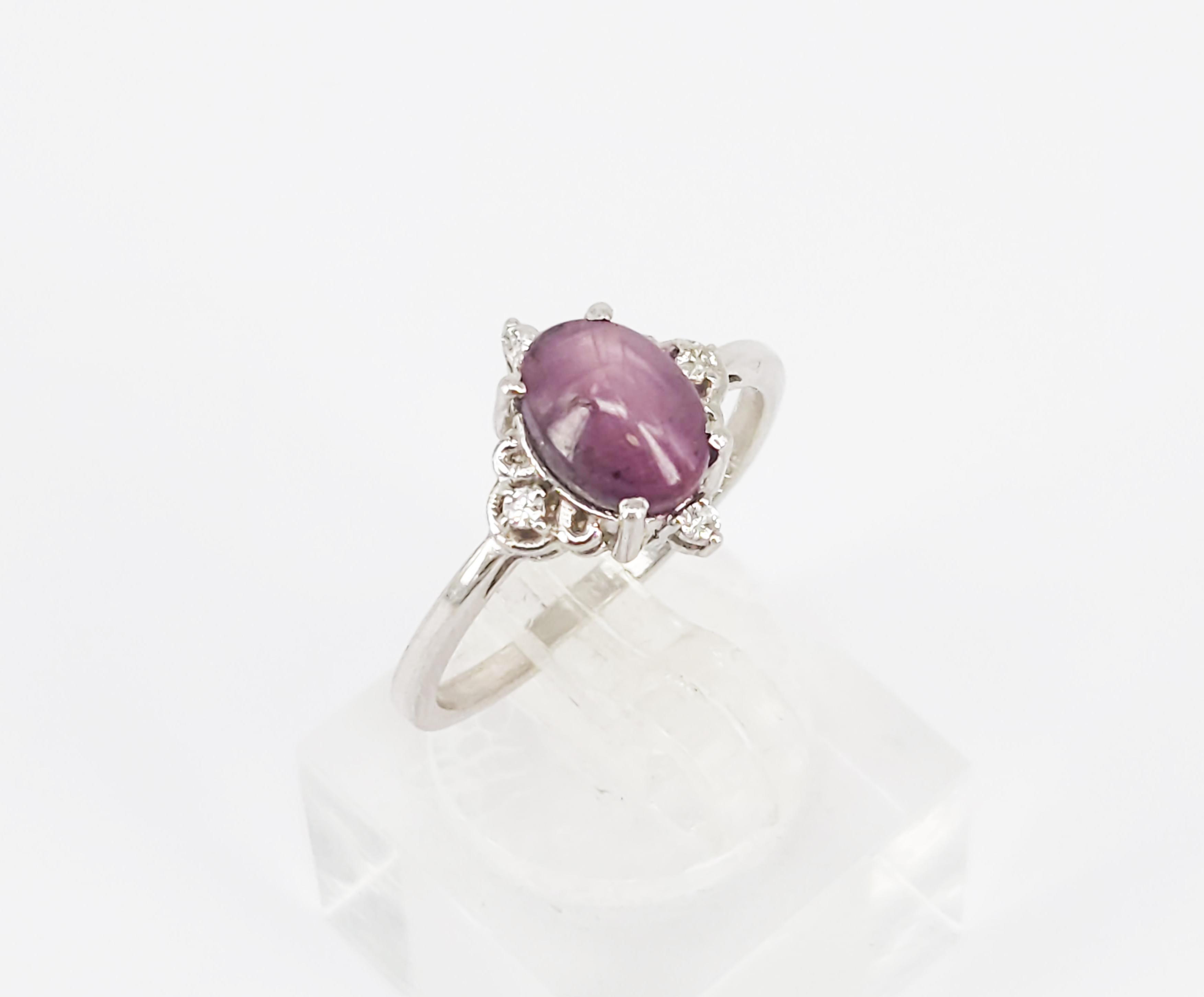 A Sterling Silver Star Ruby Cabochon And Diamond Ring