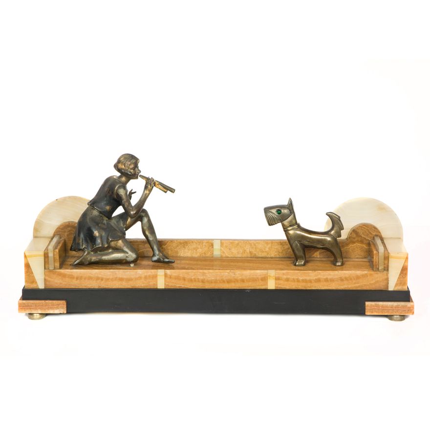 An Art Deco patinated metal, onyx and marble figural group of a young woman and her dog after a model by Geo Maxim