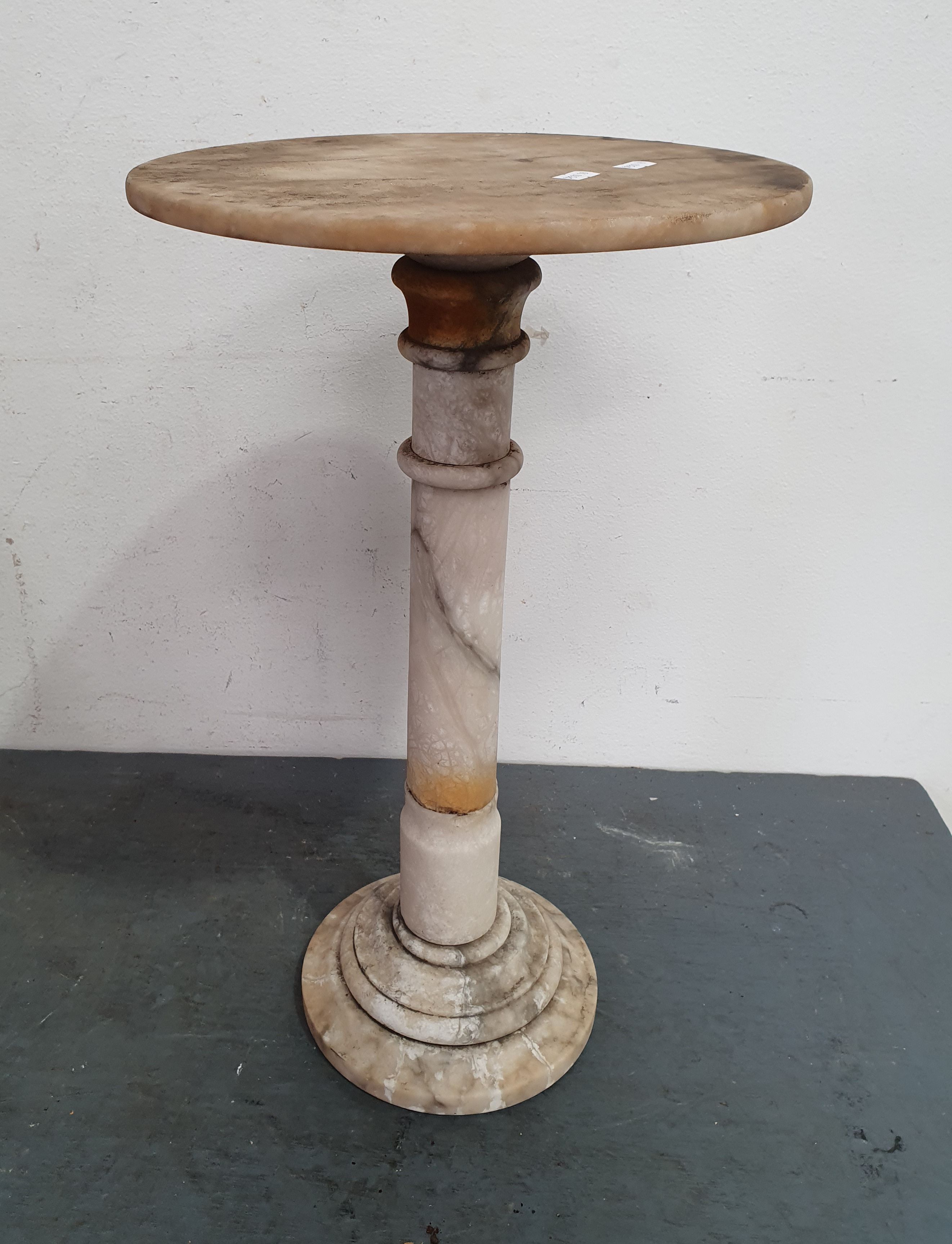 A MARBLE SIDE TABLE