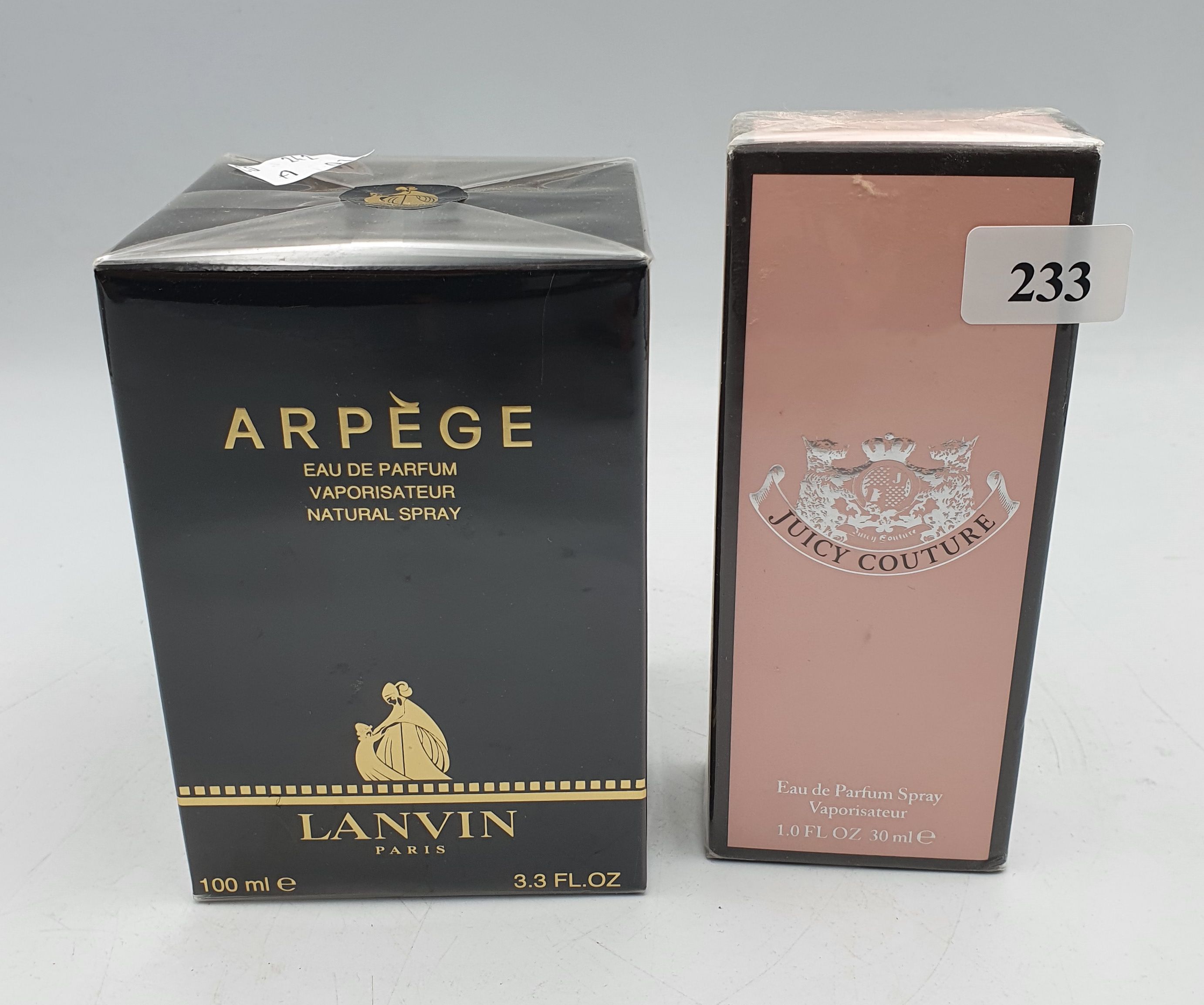 233 · TWO SEALED BOTTLES OF PERFUME