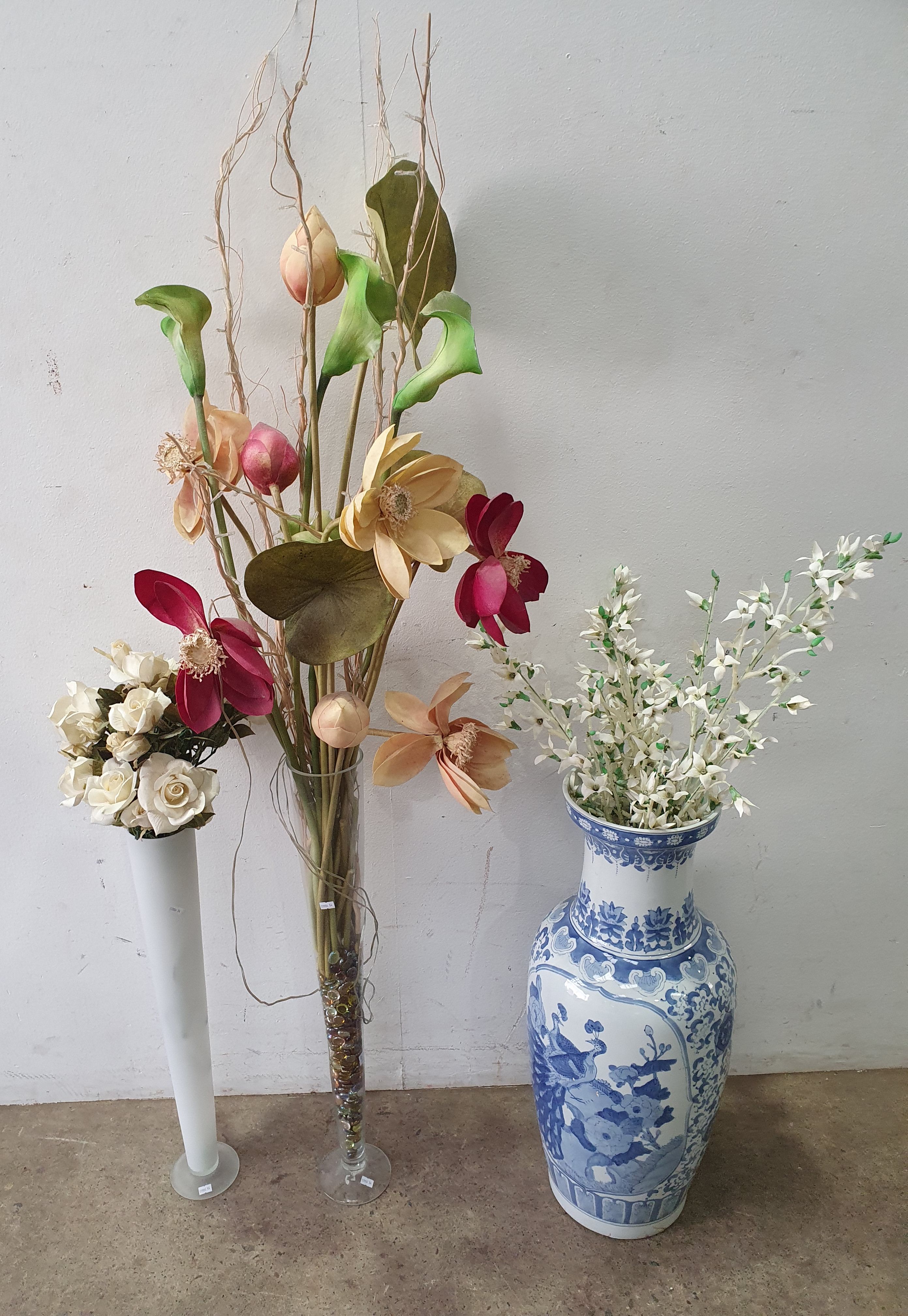 A TRIO OF VARIOUS VASES WITH FAUX FLOWERS